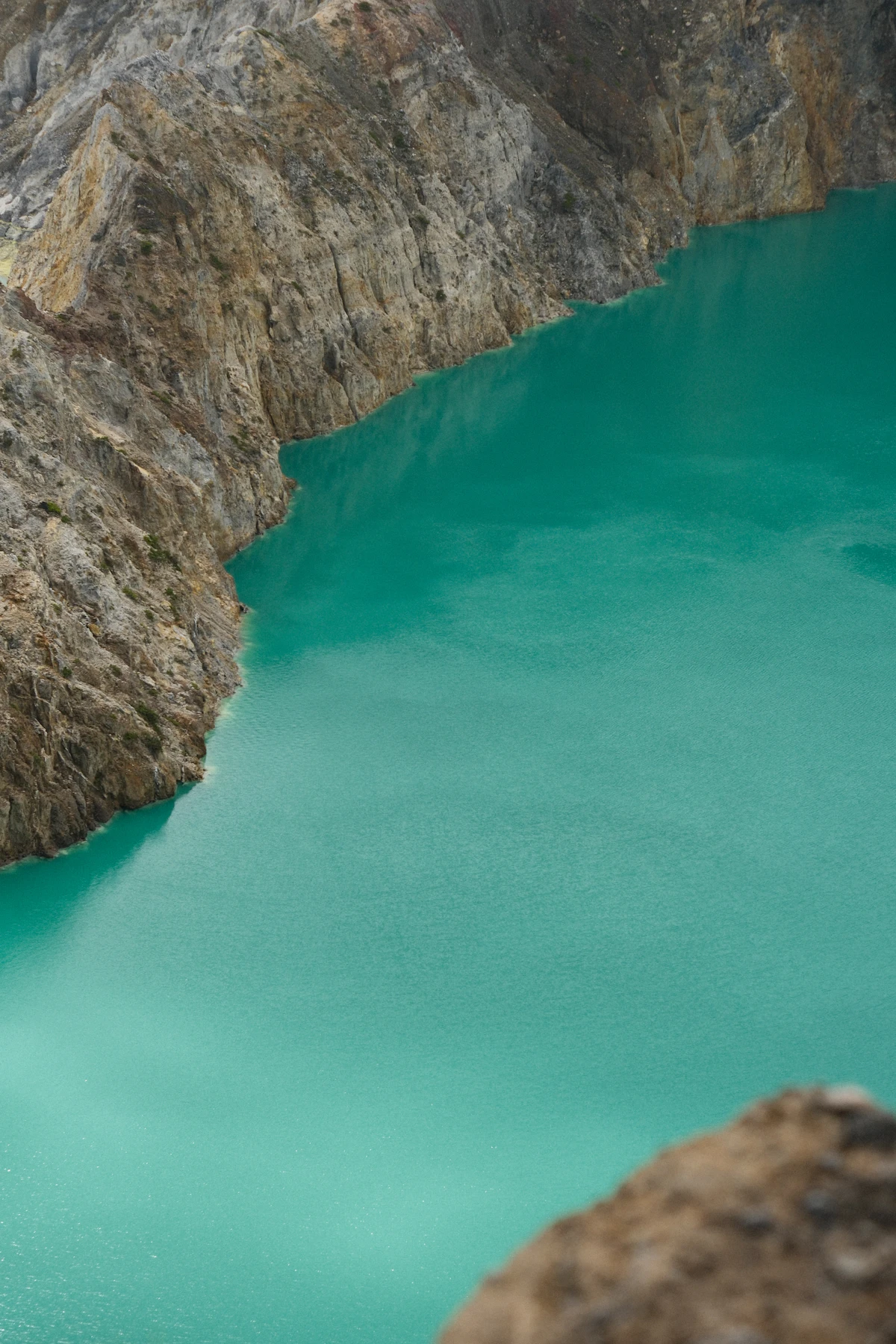 Three colored volcanic crater lakes atop Mount Kelimutu in Flores