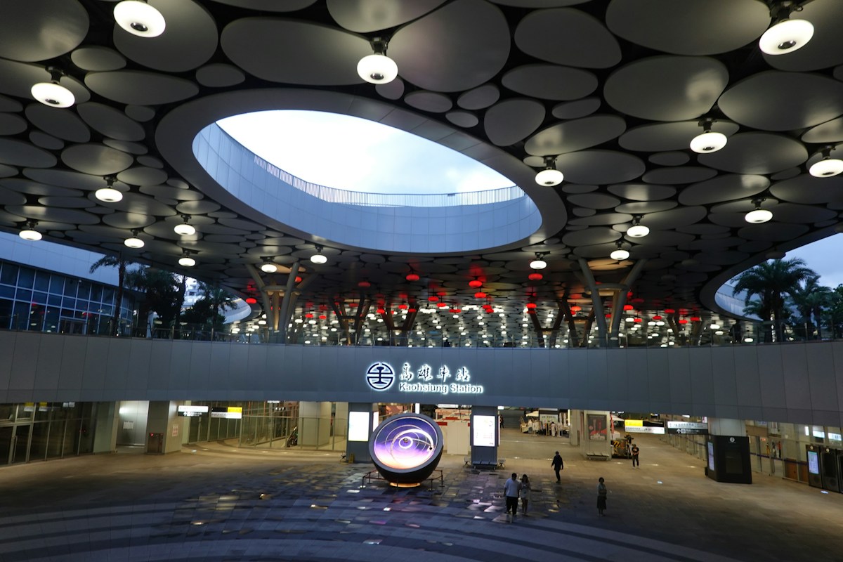 The new Kaohsiung Main Station: sunken plaza under the canopy and the station name sign