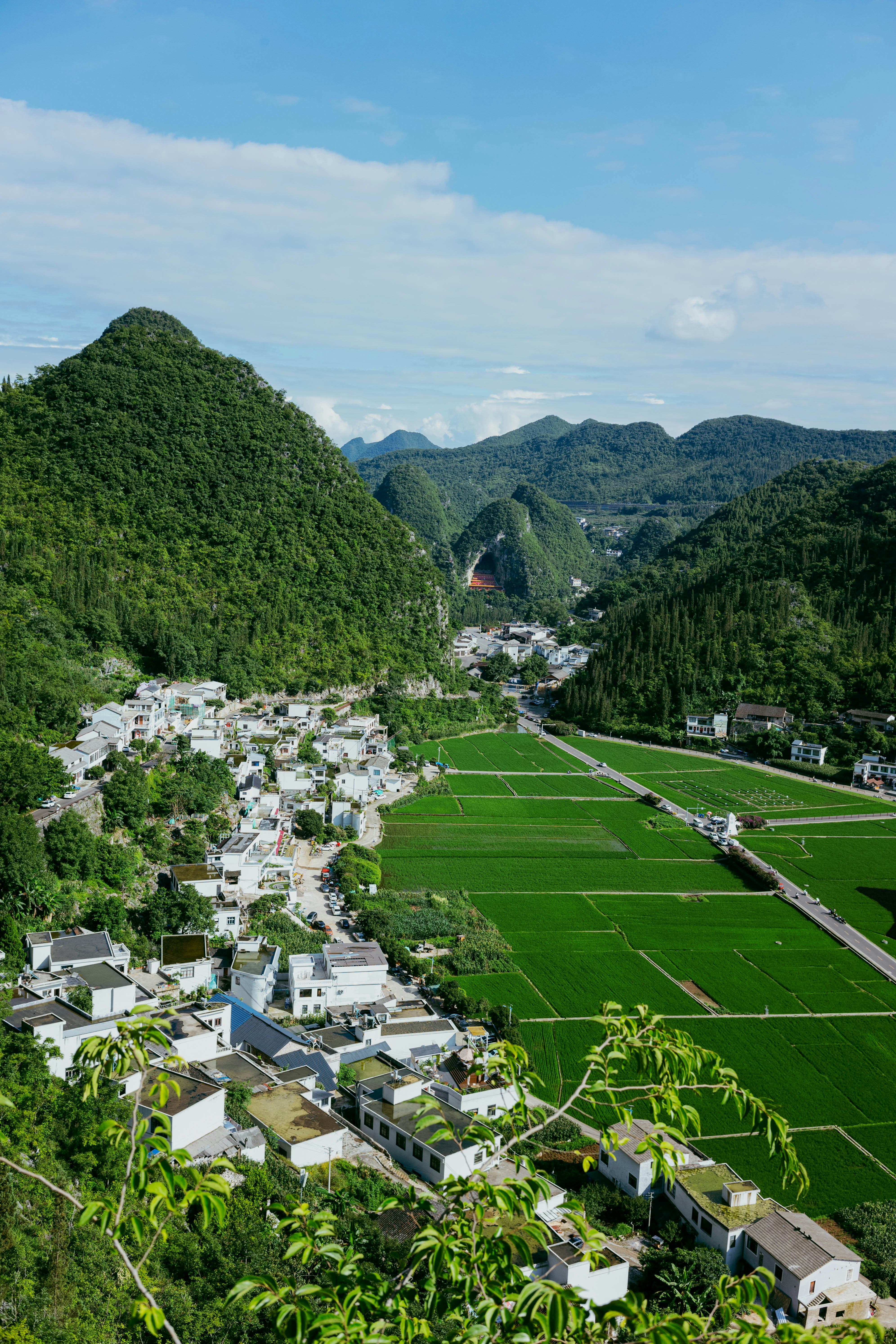 Green countryside and mountains near the town