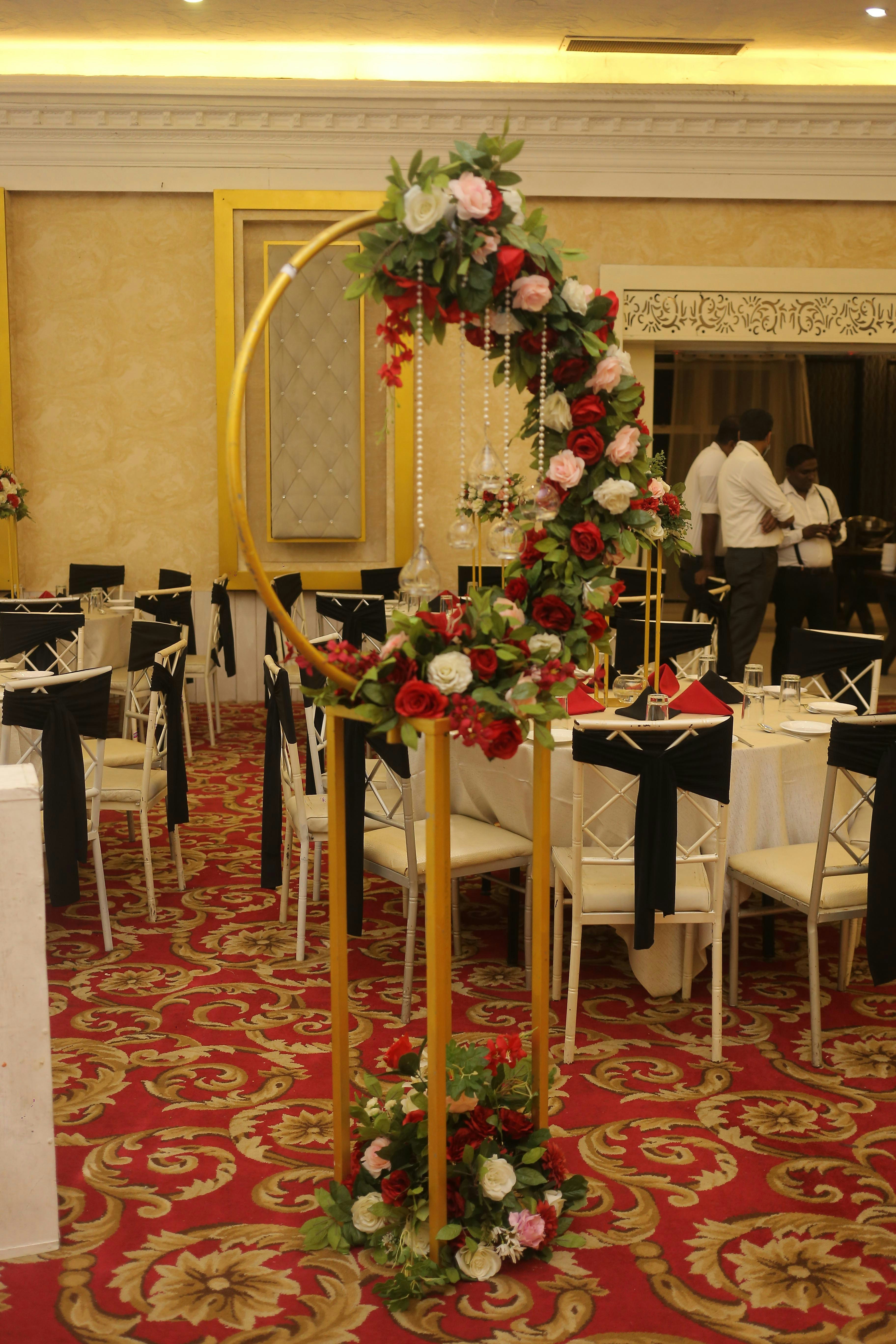 The AC hall laid for 350. Red carpet is ours; the florals are not.