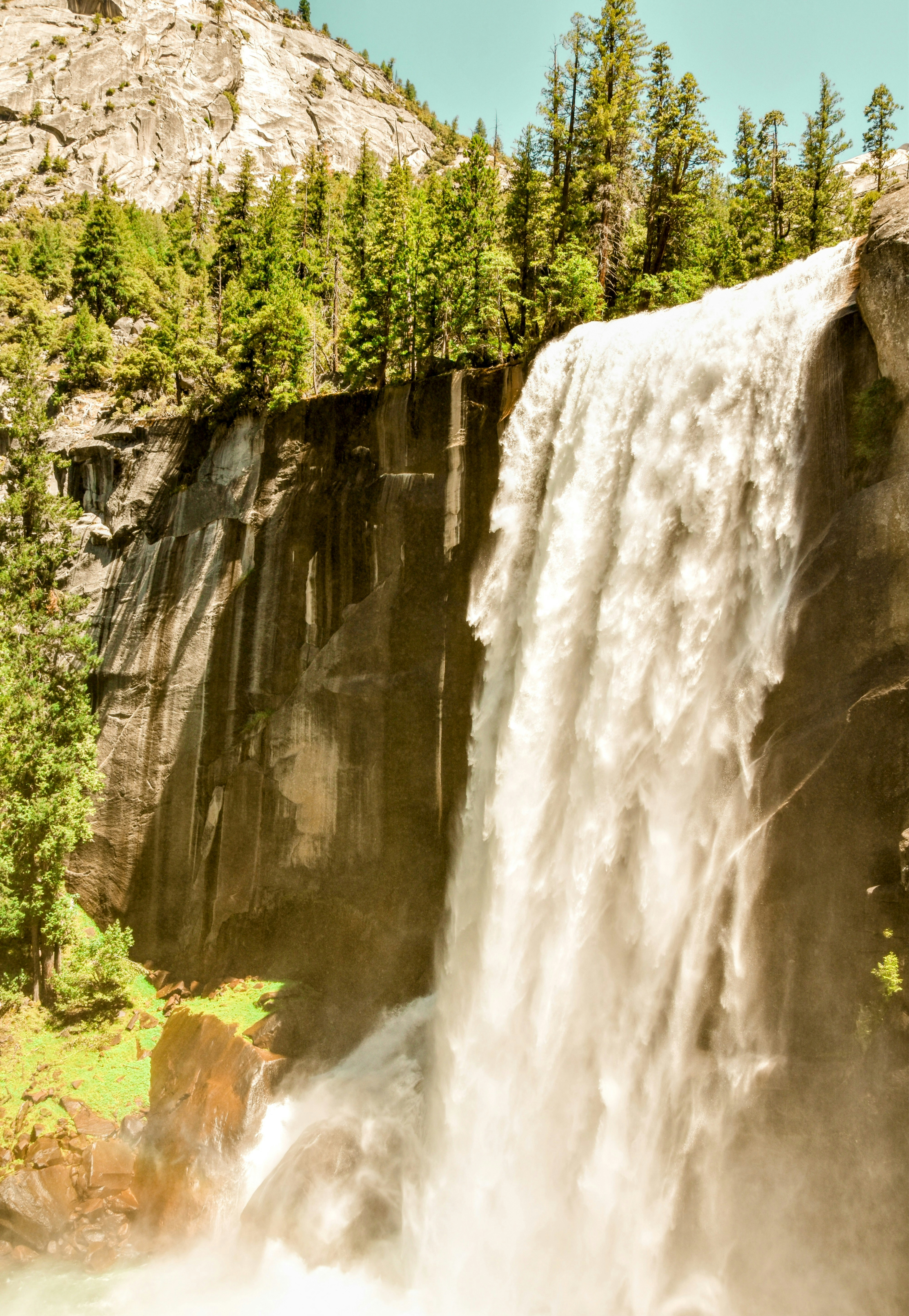 Vernal Fall cascading over a granite cliff in Yosemite National Park