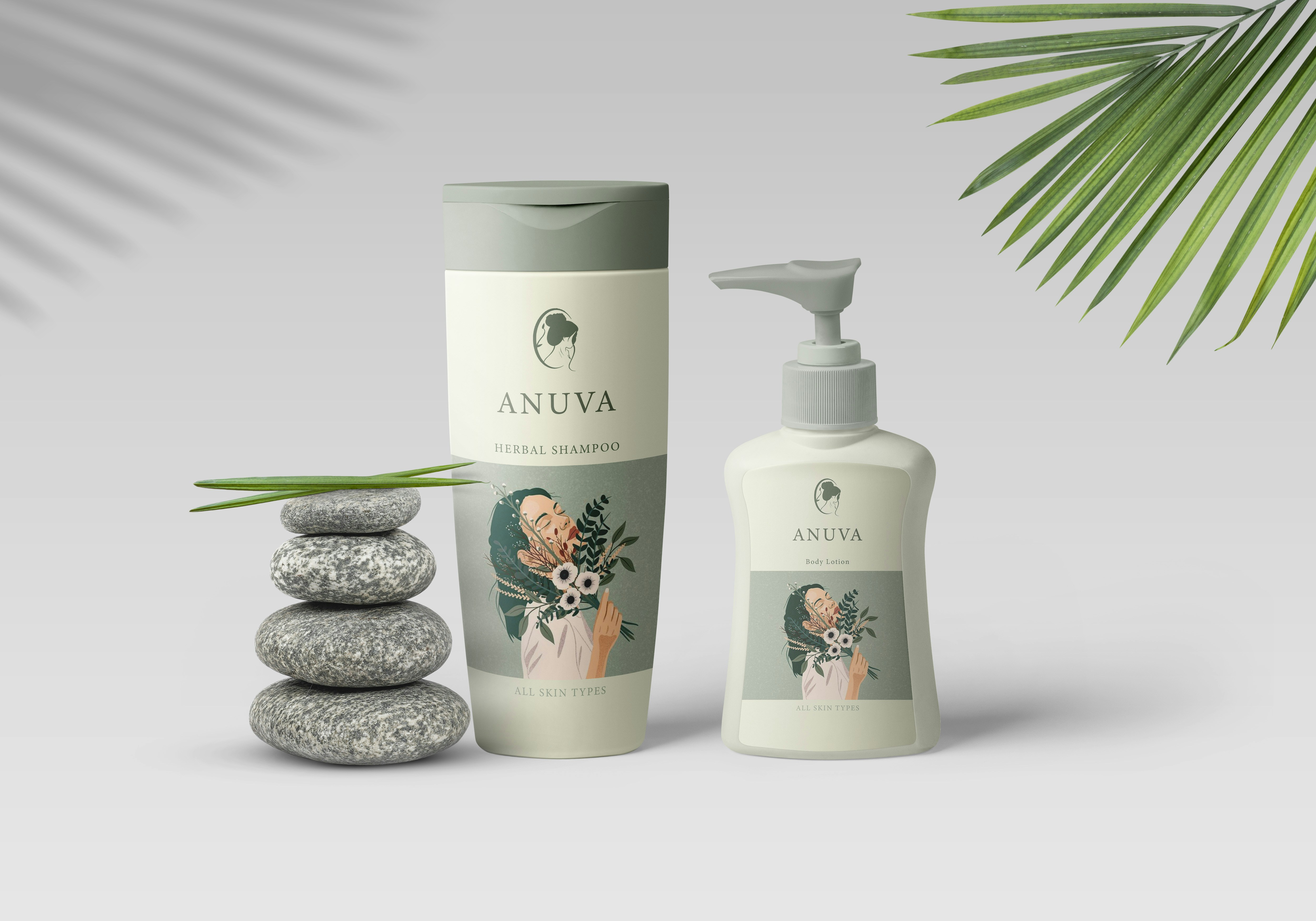 A shampoo bottle and a lotion pump beside a stack of four grey stones