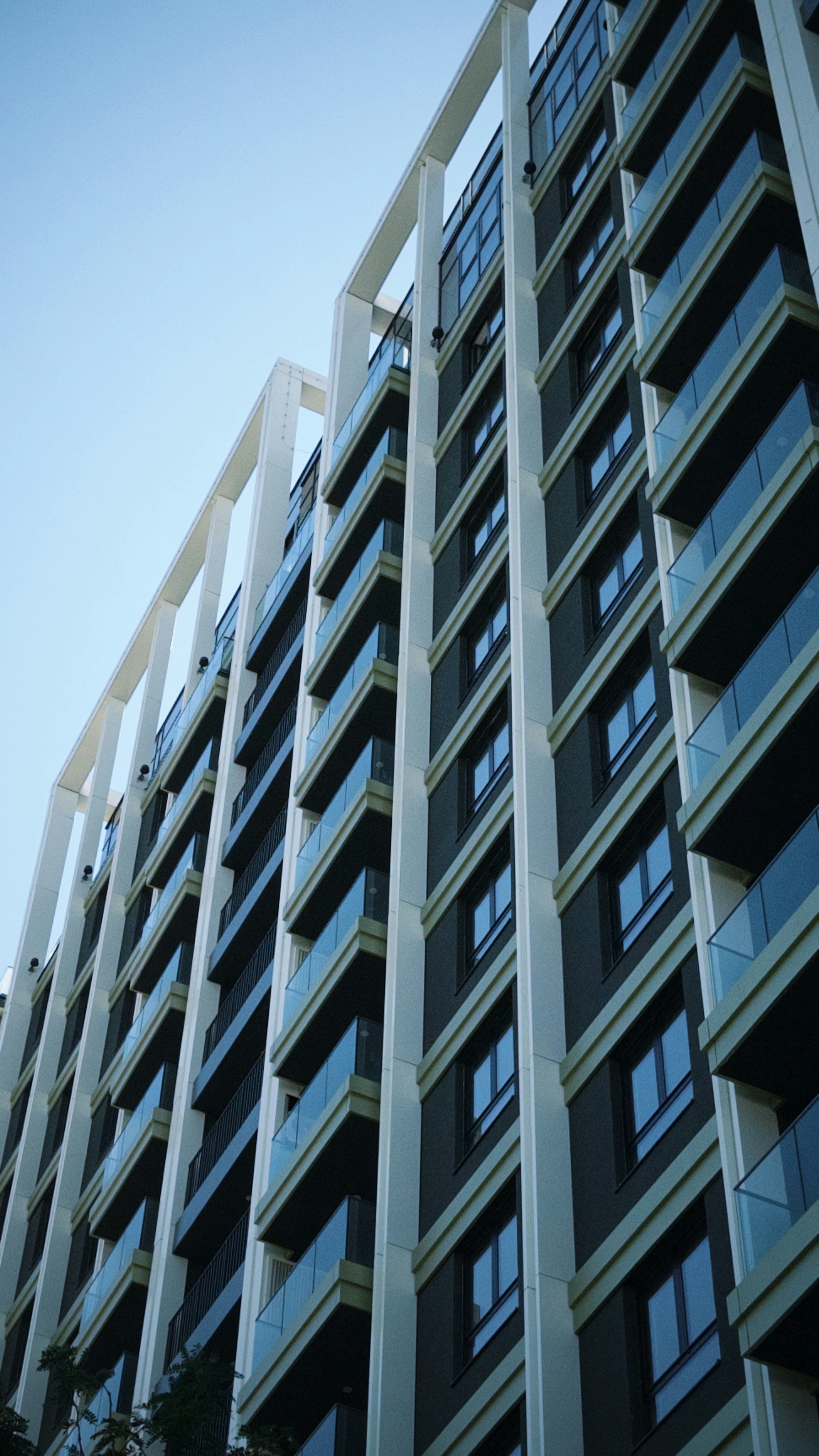 Modern apartment building with glass balconies - Free Photo on Unsplash