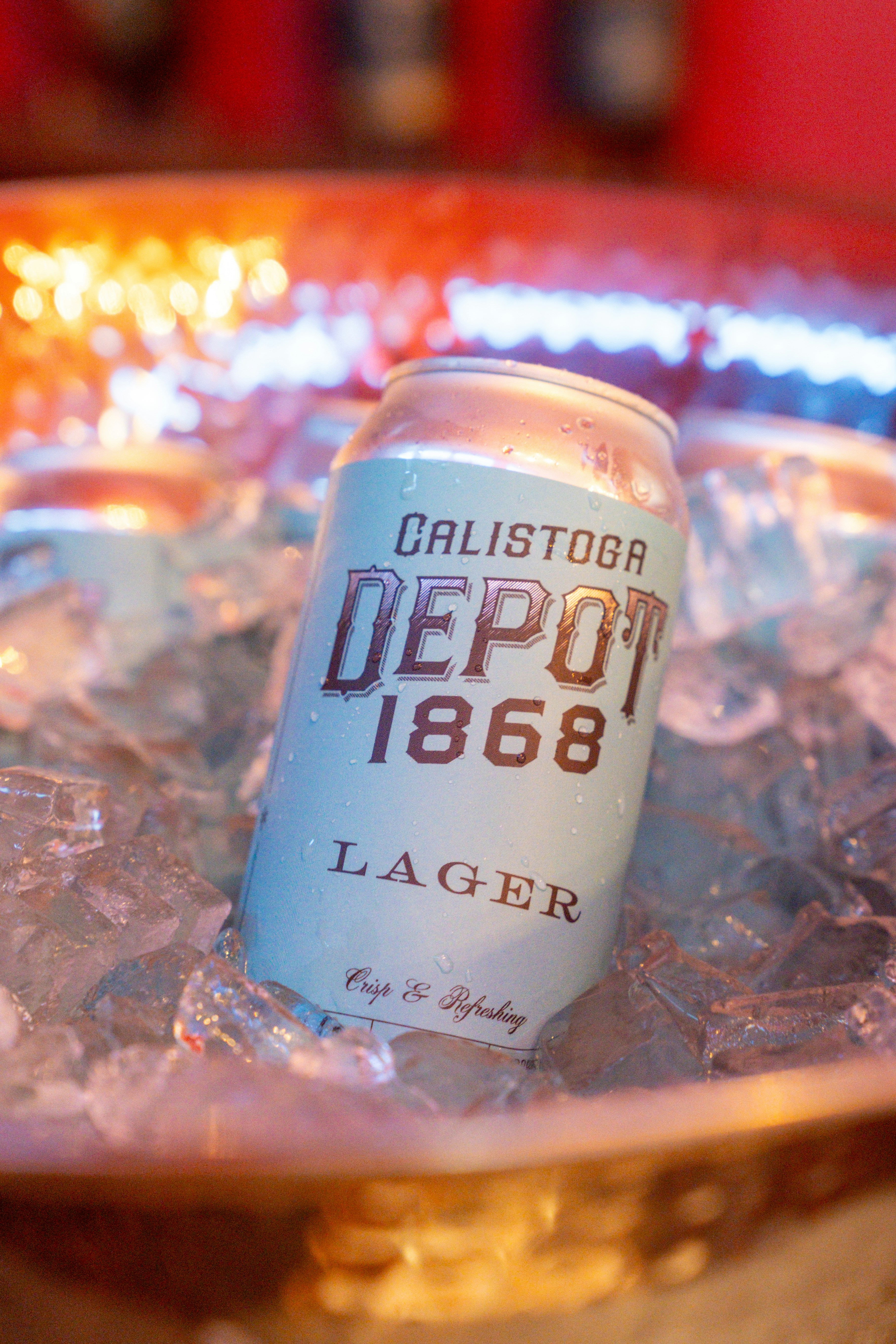 A can of Calistoga Depot 1868 lager nestled in a bucket of ice