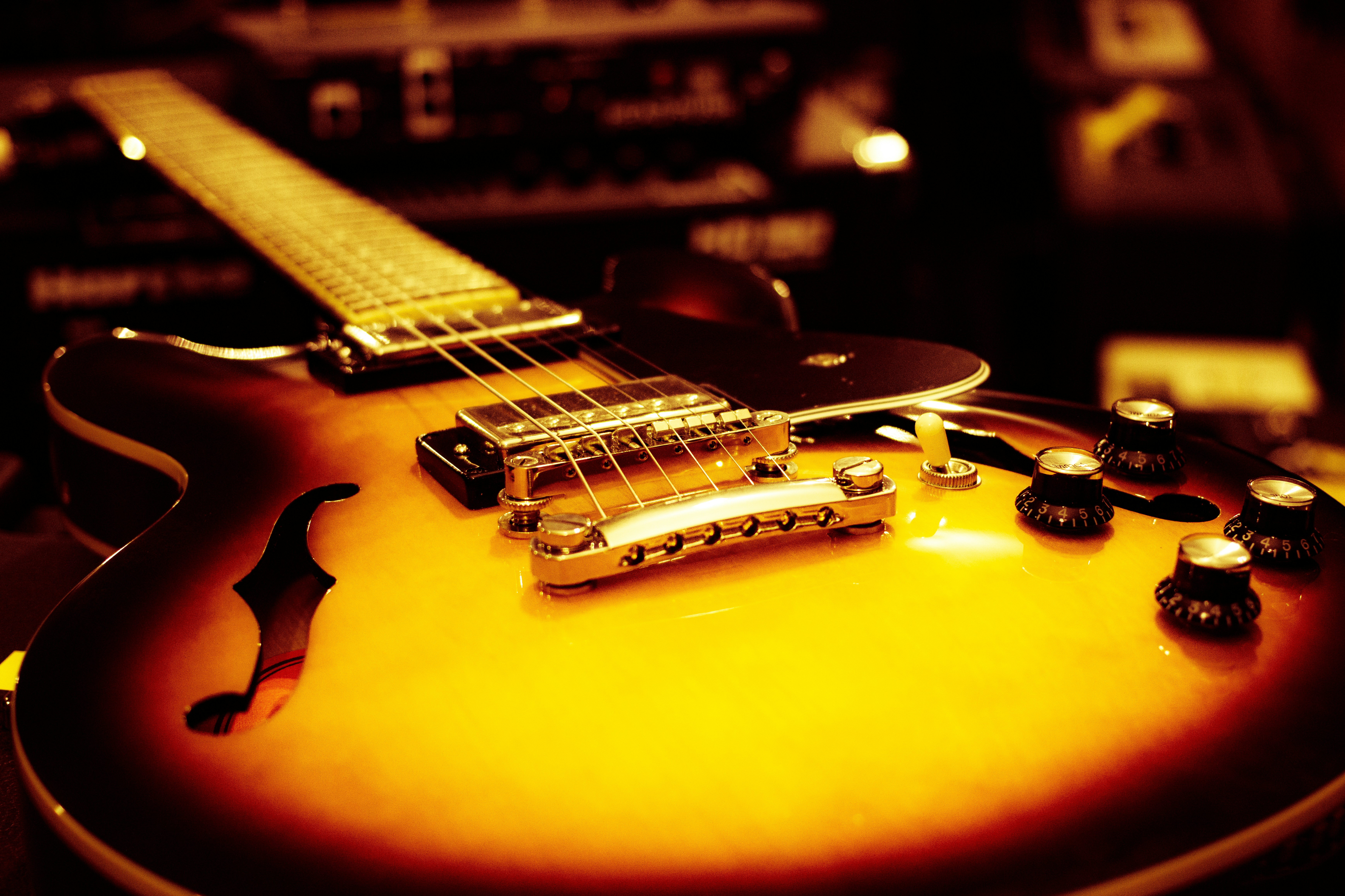 Hollow-body electric guitar in warm light - Free Photo on Unsplash