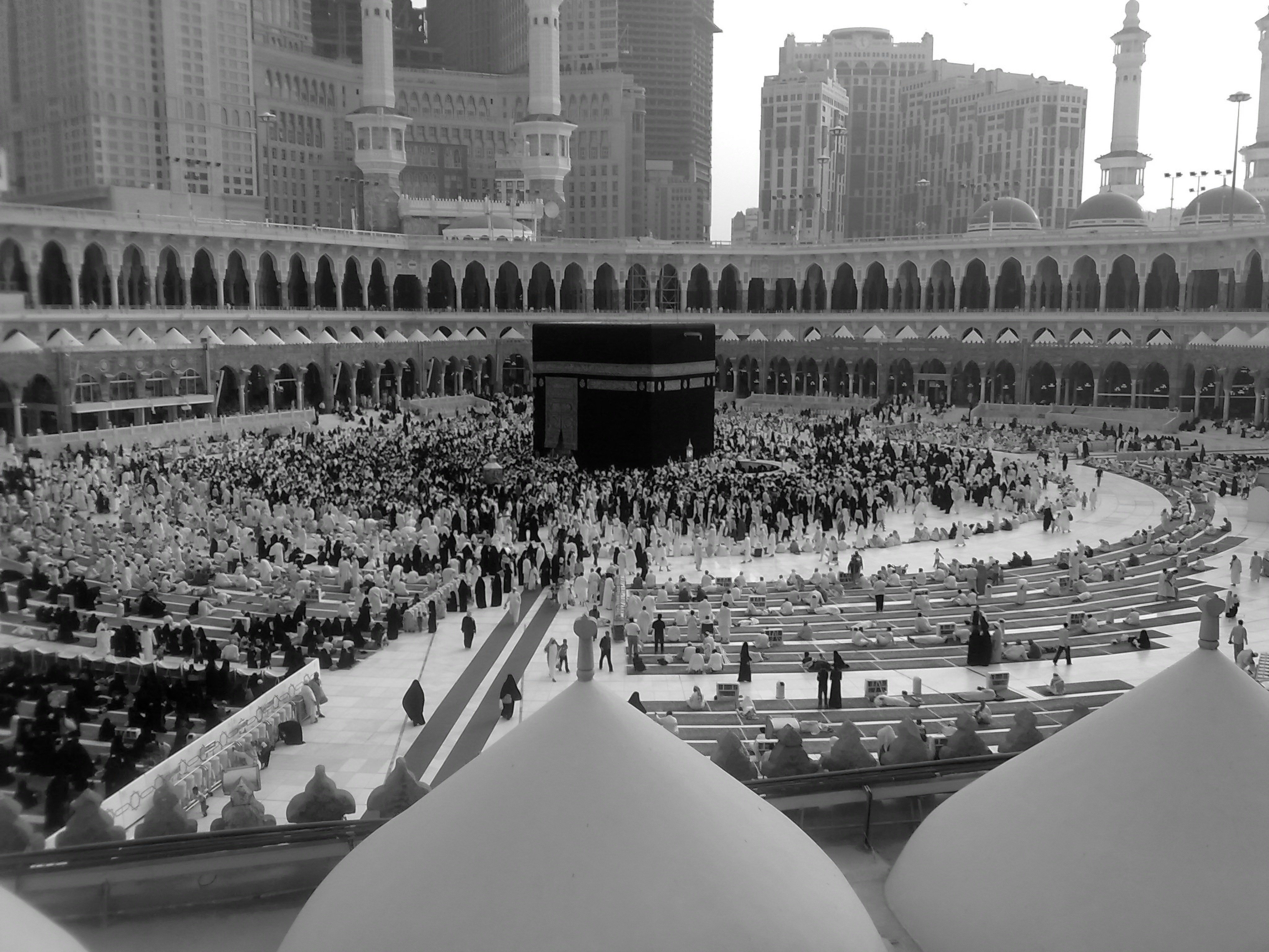 A crowd of people surrounding the Kaaba in the Masjid al-Haram in Mecca