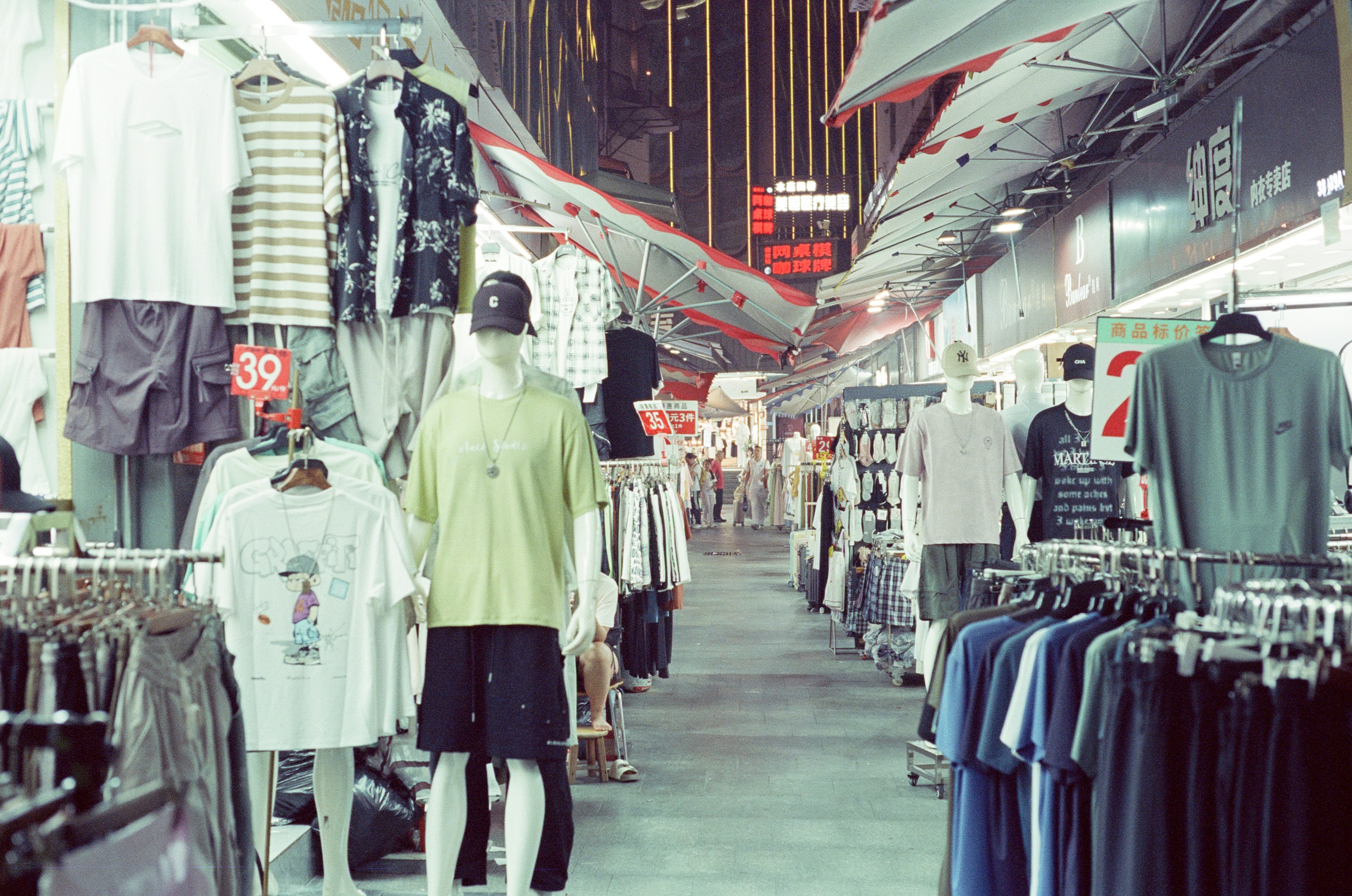 Clothing racks and mannequins in an arcade