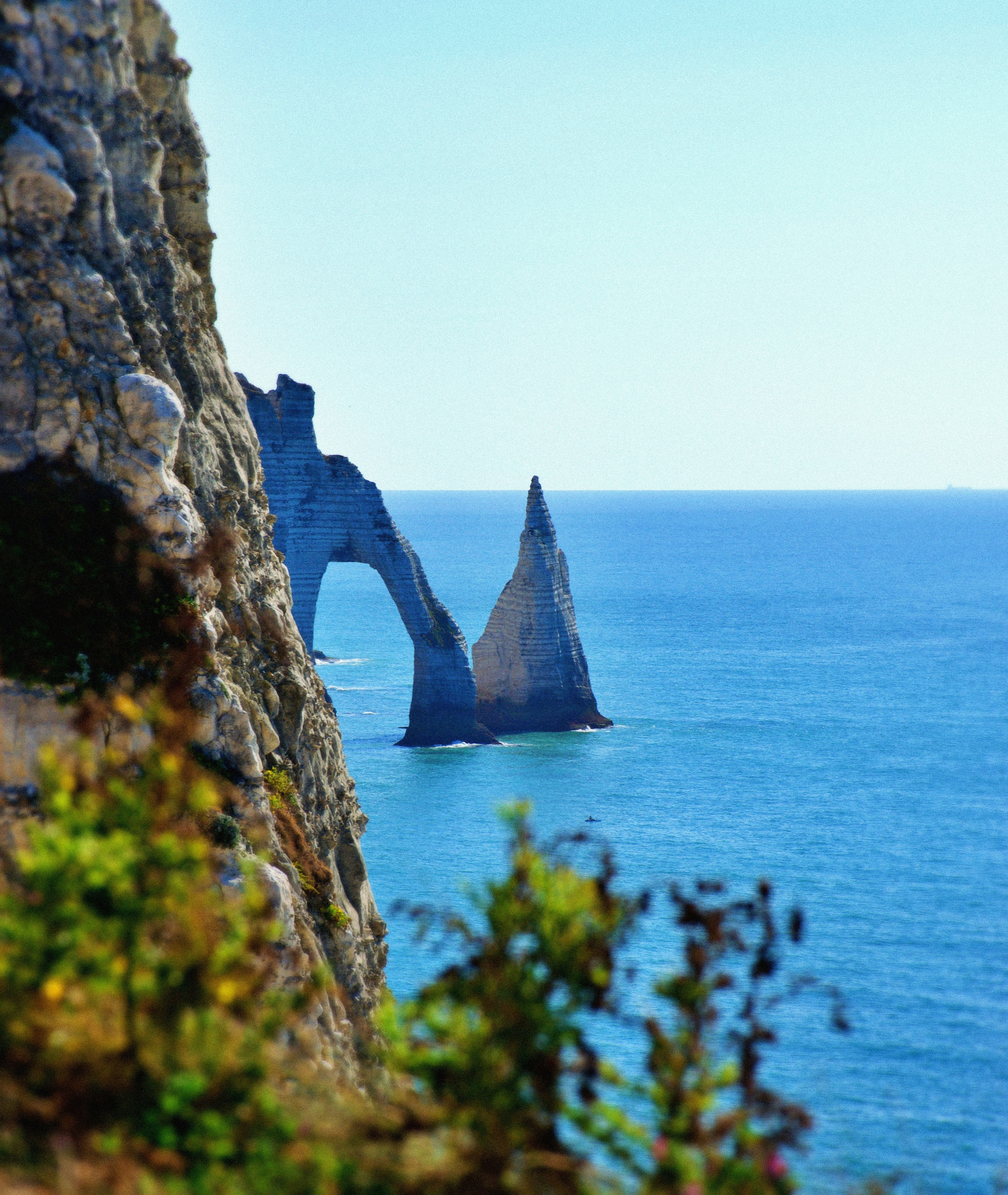 The natural stone arch and needle rock formation at Étretat in France