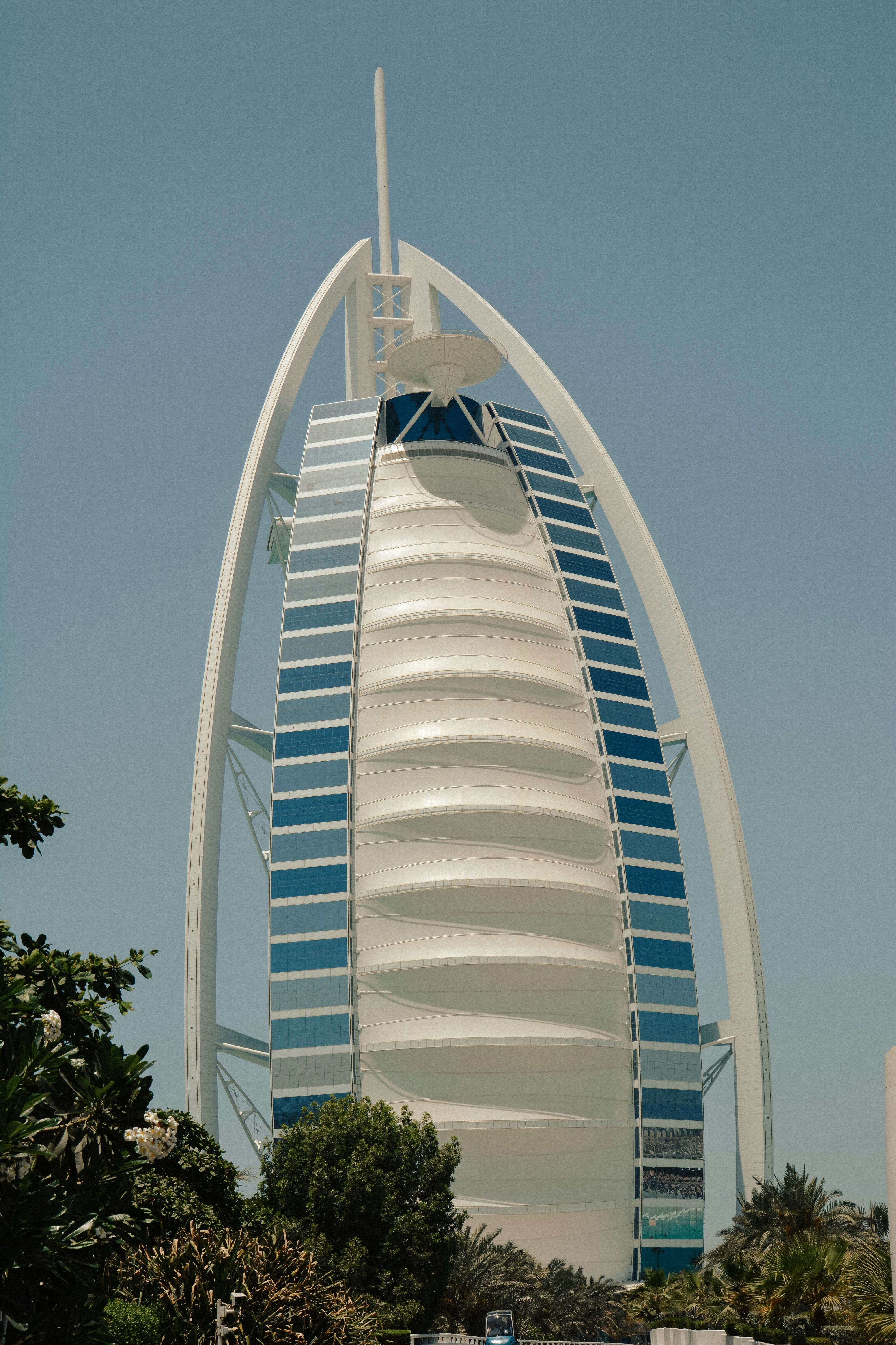 The Burj Al Arab hotel in Dubai against a clear blue sky