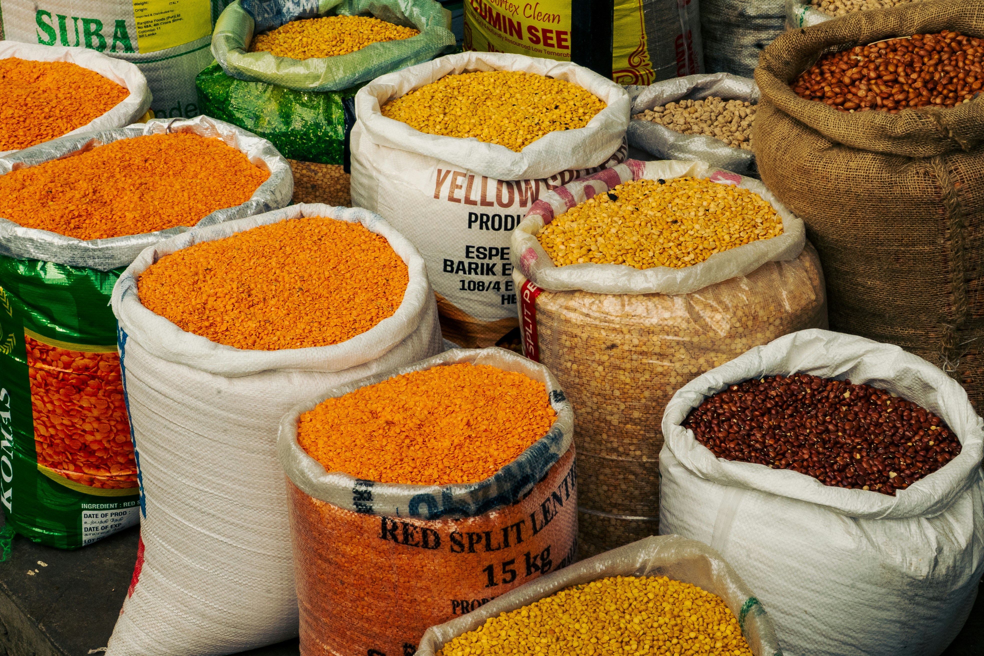 Open sacks of rice, dal and pulses at a ration supplier