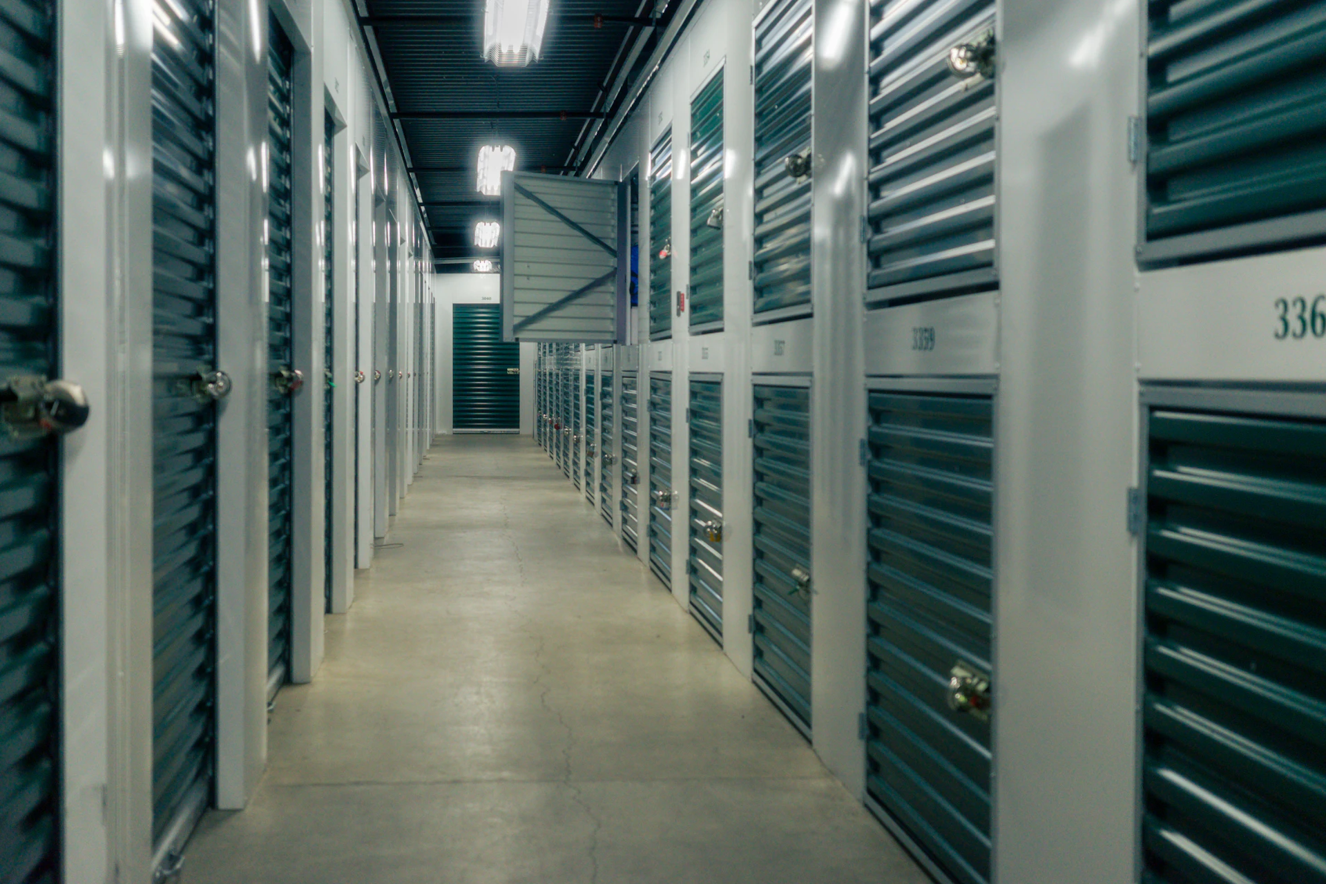 Clean, well-lit corridor of self-storage units