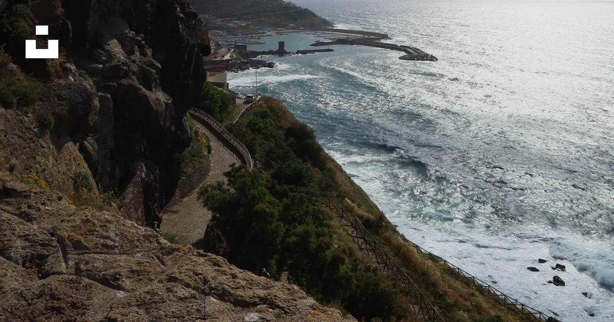 Compass Lisa Rd Winding road along Castelsardo cliff - Free Photo on Unsplash