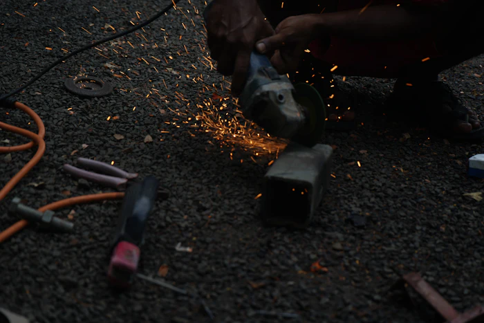 Cutting metal with sparks in the workshop