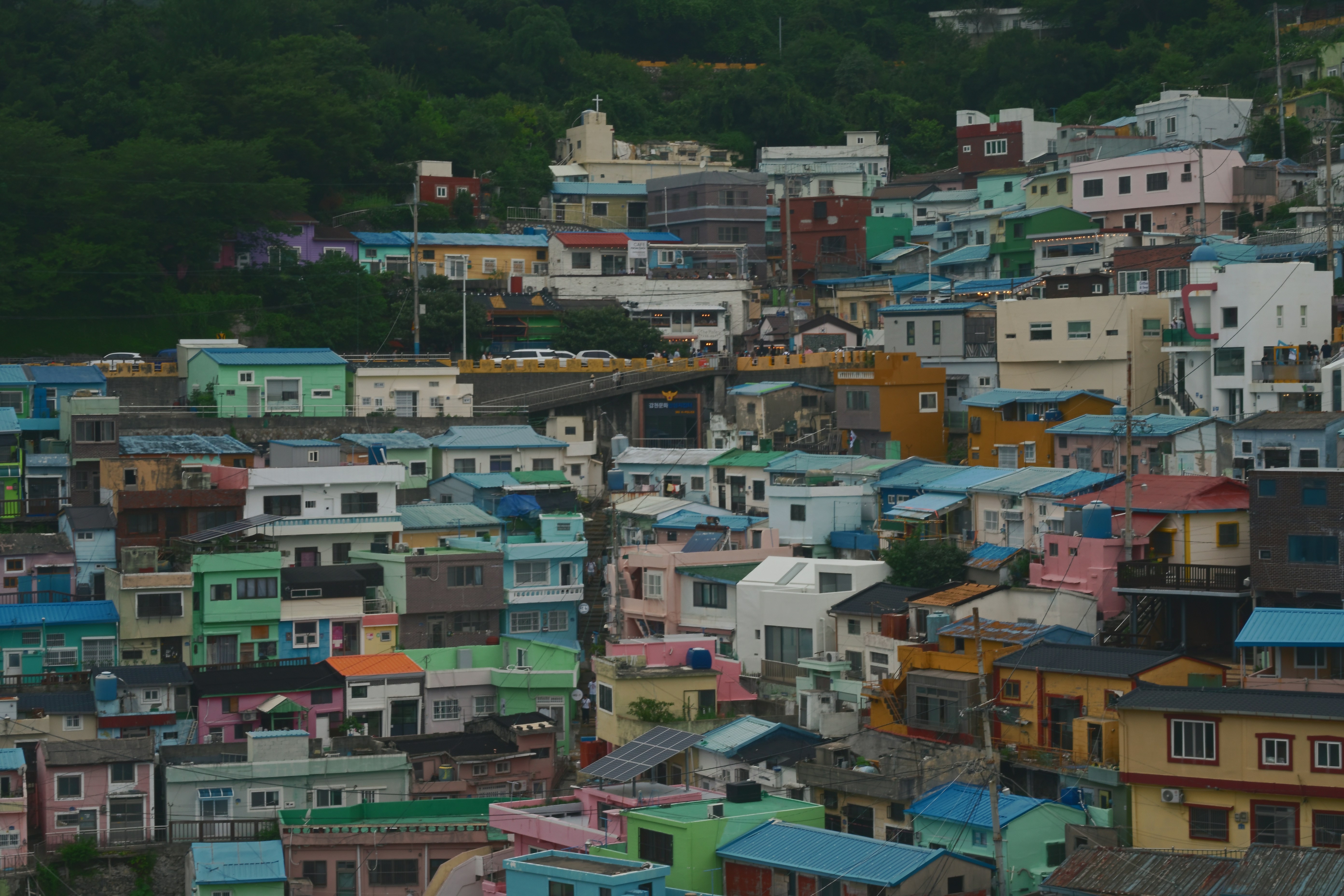 Colorful houses densely packed on a hillside in Gamcheon Culture Village, Busan