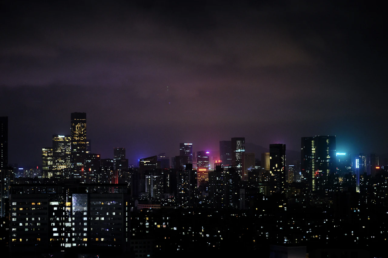 City skyline with glowing night lights