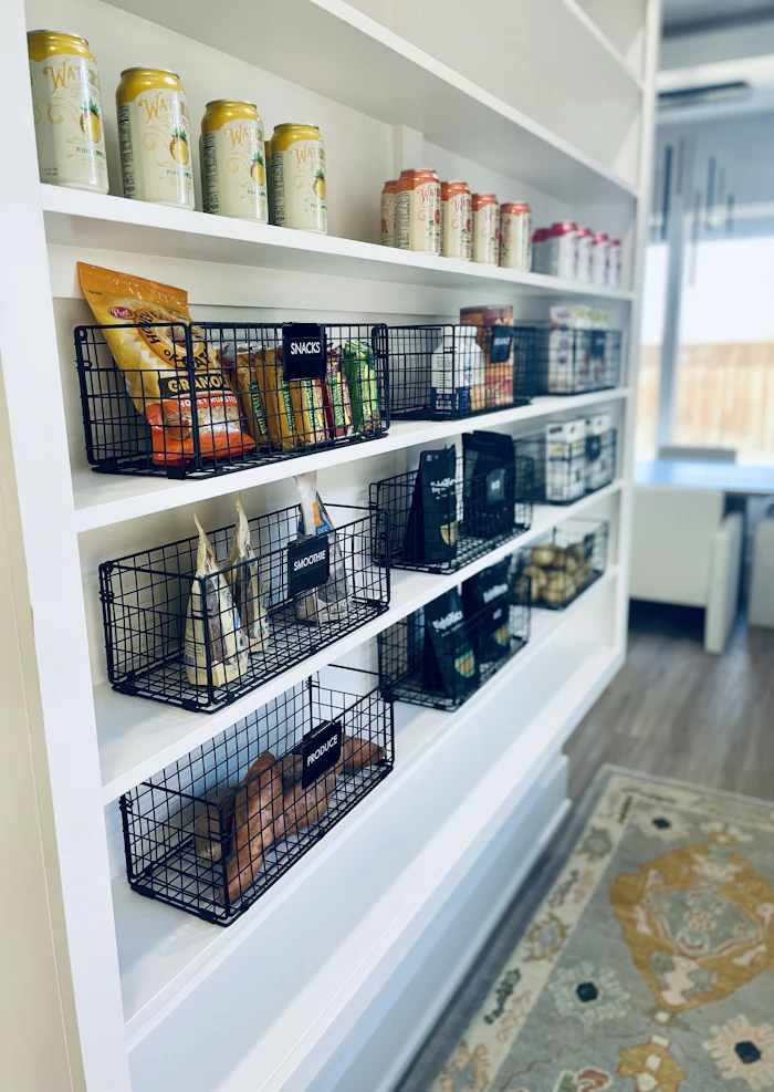 Pantry shelves with labeled wire baskets