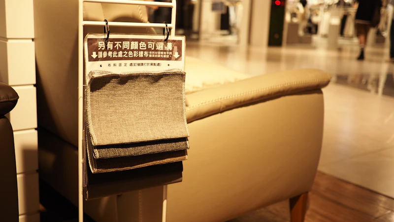 Fabric swatches beside an upholstered chair