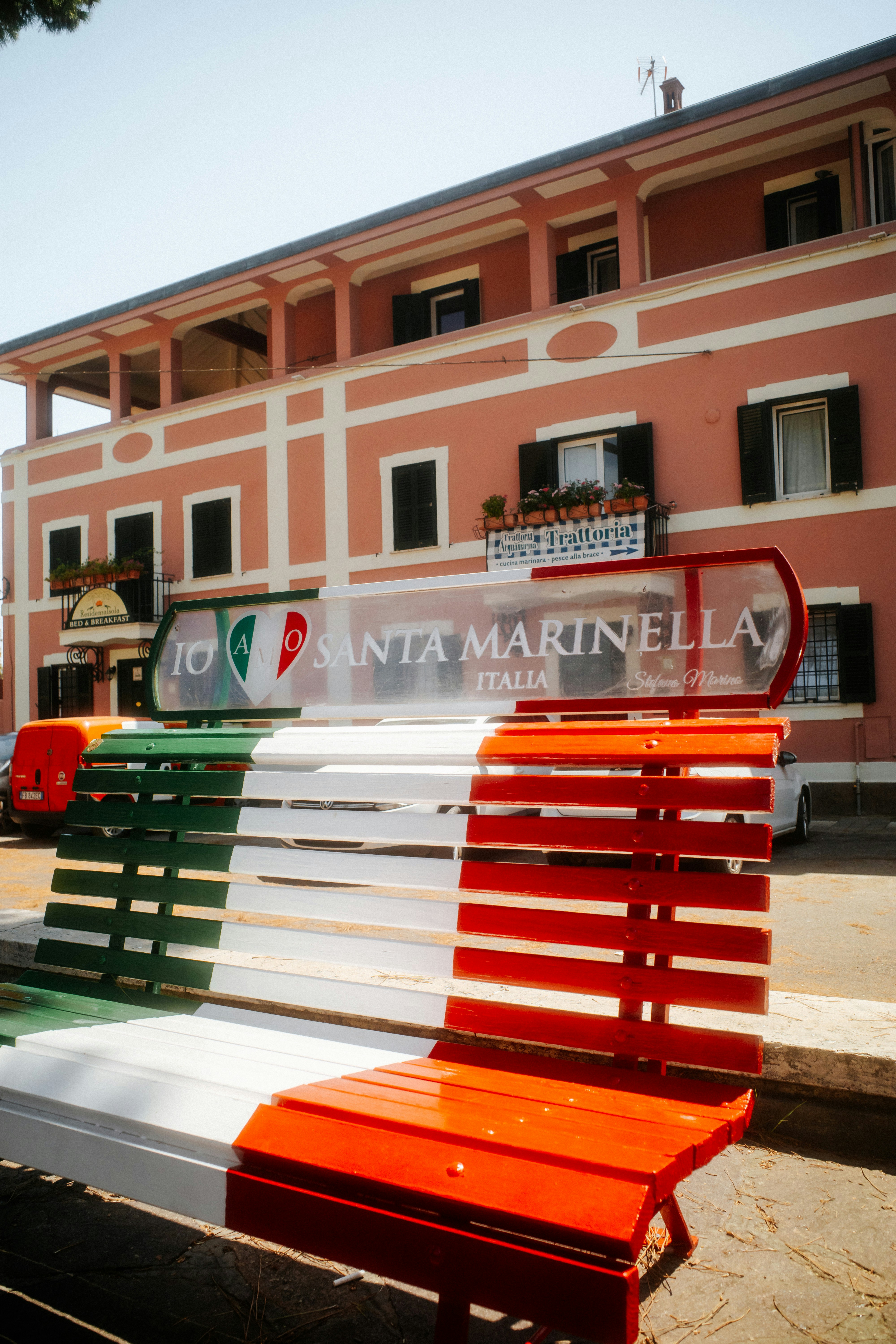 A bench painted in the Italian flag colors in Santa Marinella, Italy.