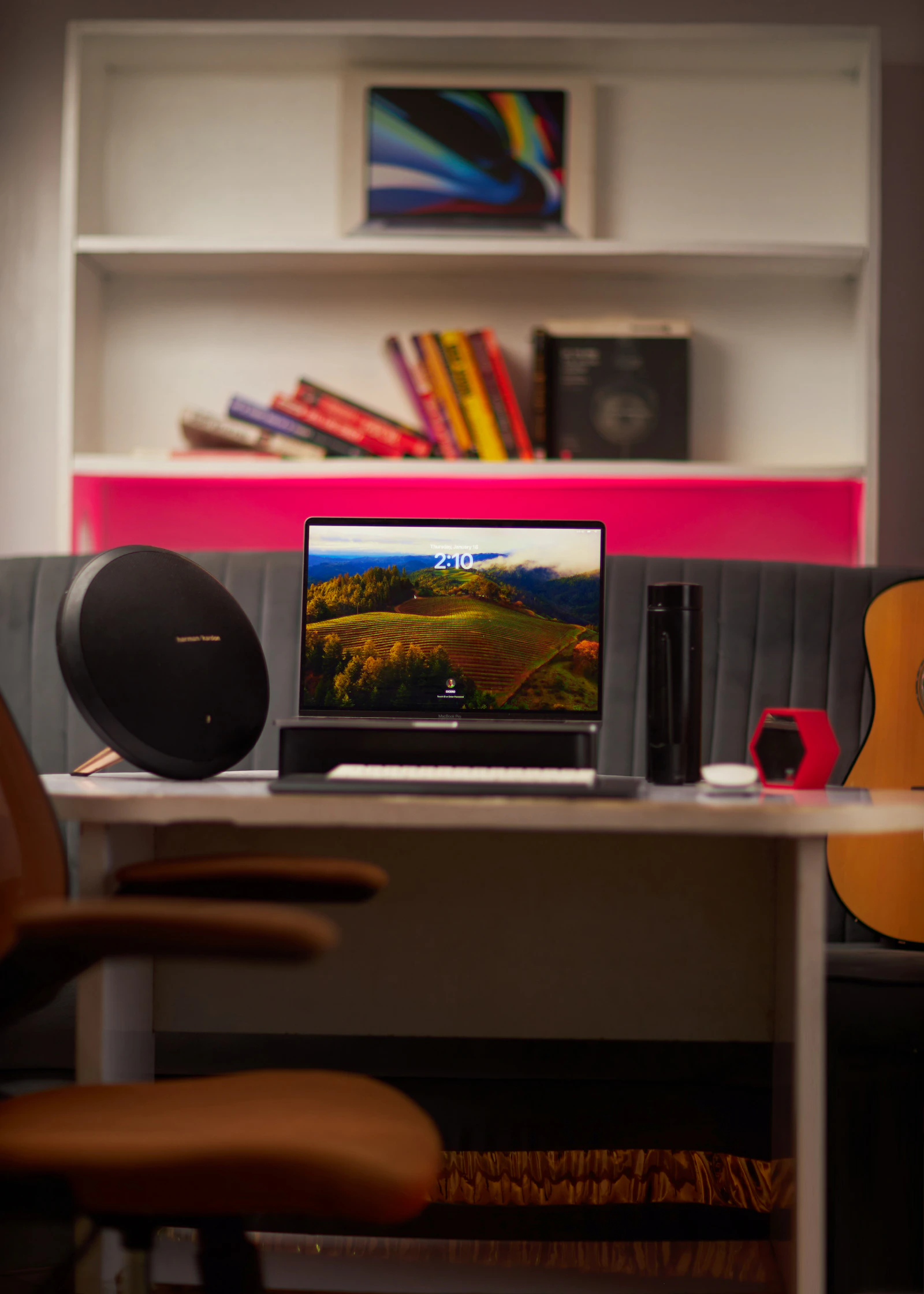 Laptop and portable speaker in a modern home workspace