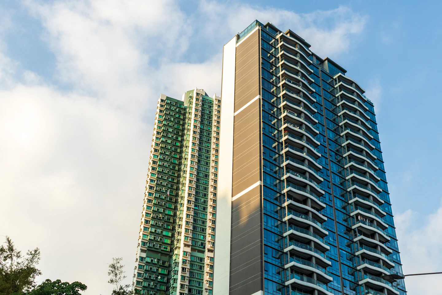 Two high-rise apartment towers with glass balconies