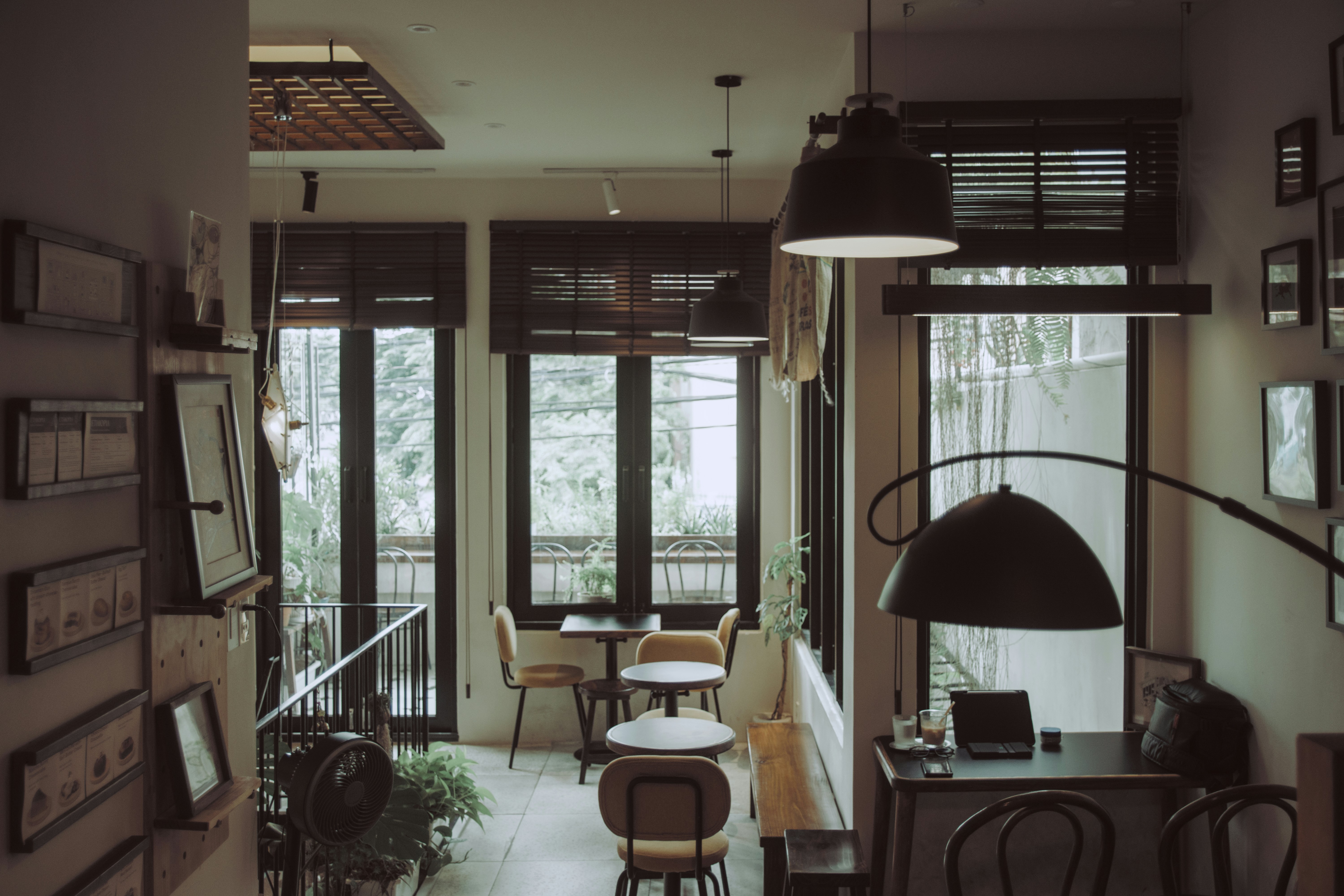 Cosy cafe interior with small round tables