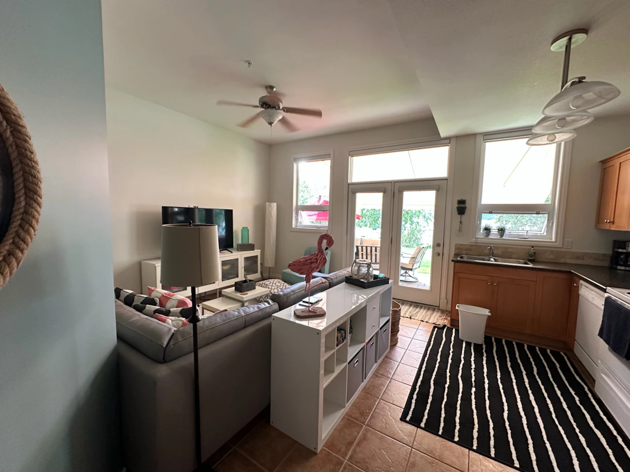 Clean furnished vacation rental living room and kitchen prepared for guests