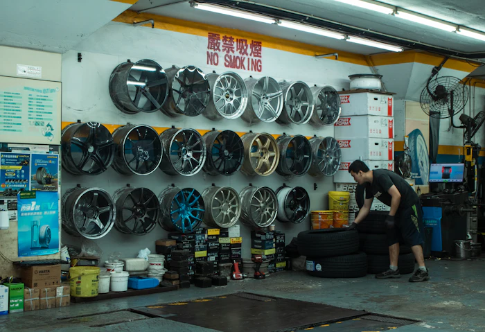 Wall of tyres and wheels in the store