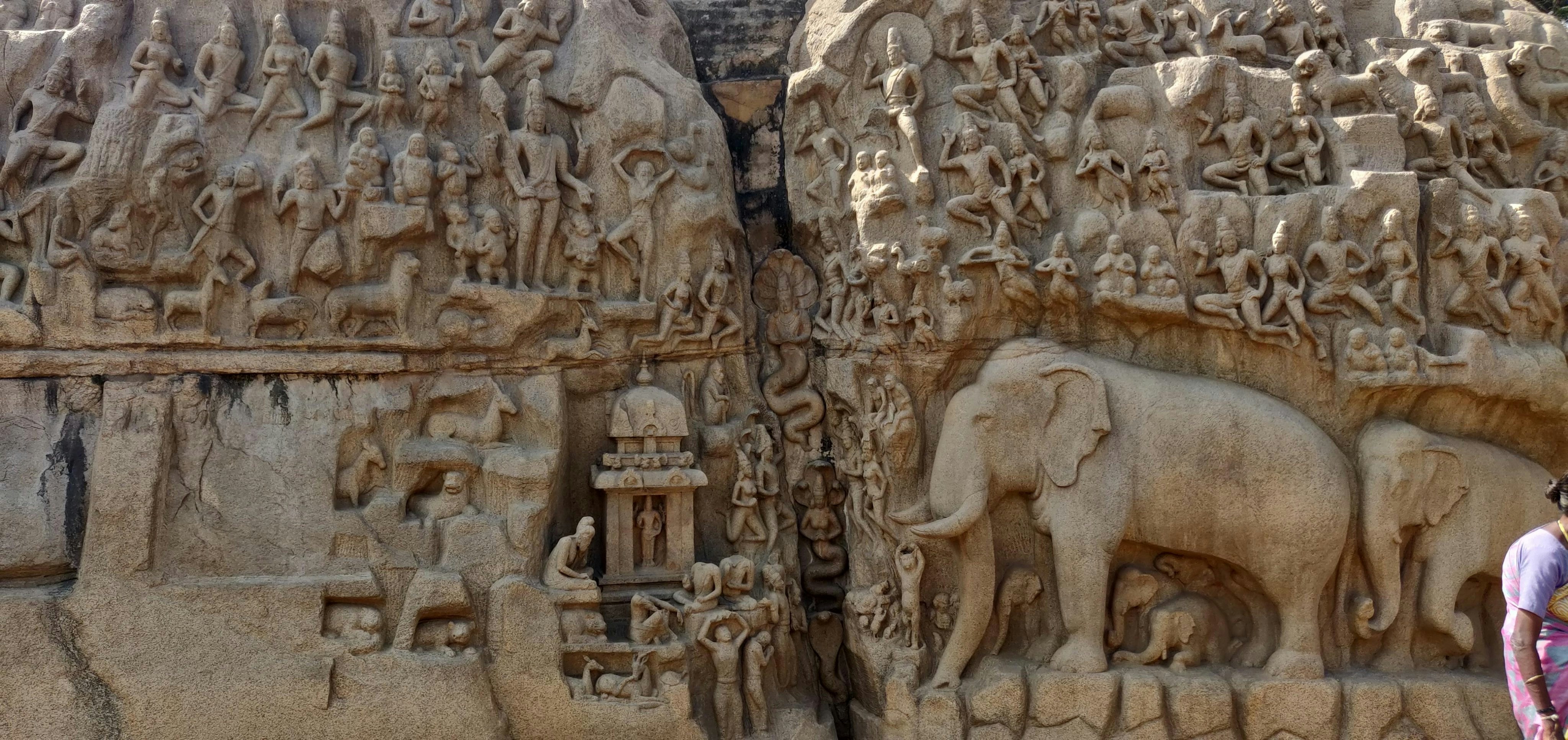 Intricate stone carvings of elephants and figures on the Descent of the Ganges in Mahabalipuram
