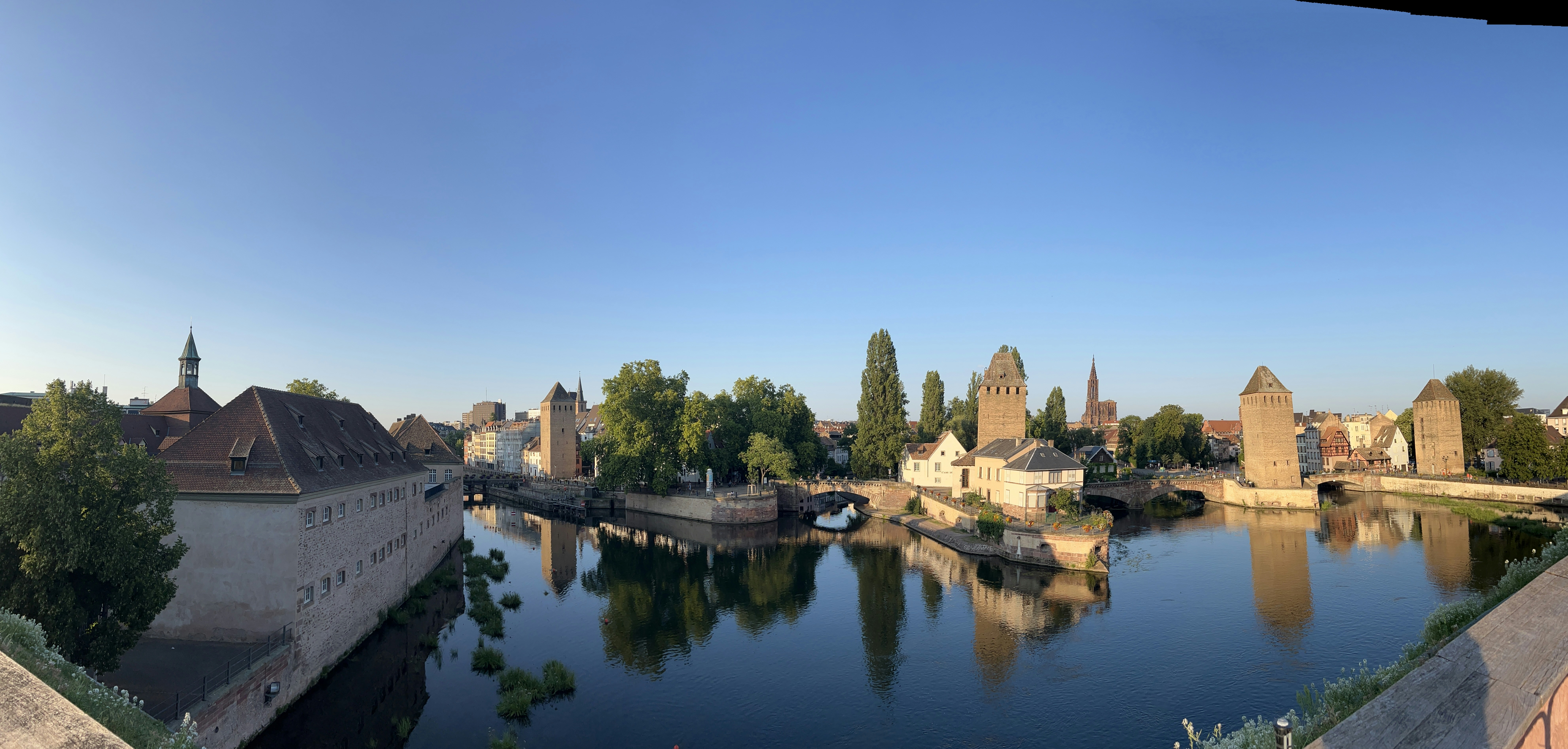 The Ponts Couverts and medieval towers reflected in the Ill river in Strasbourg