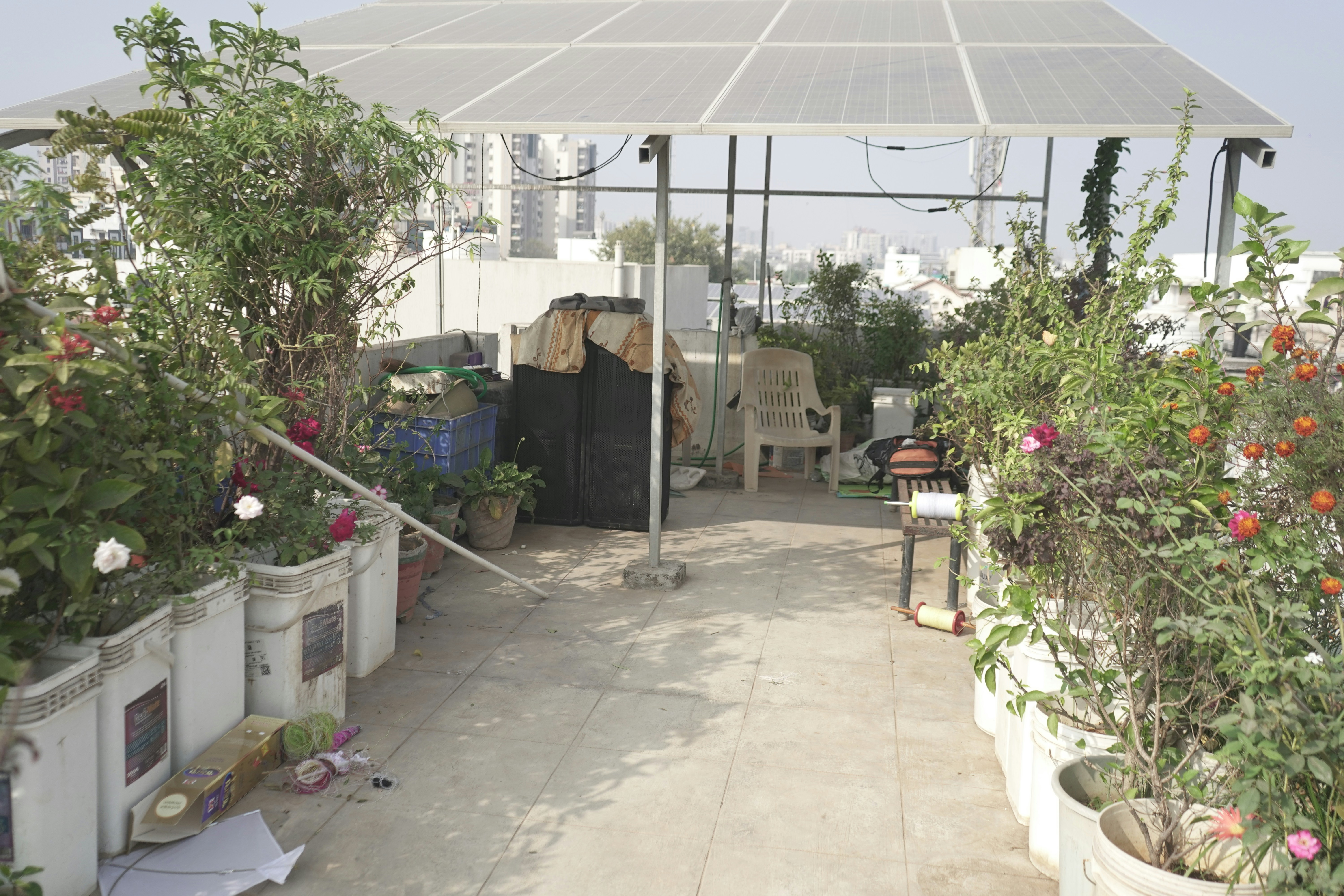 homeowner wiping a solar panel on a balcony with a soft cloth