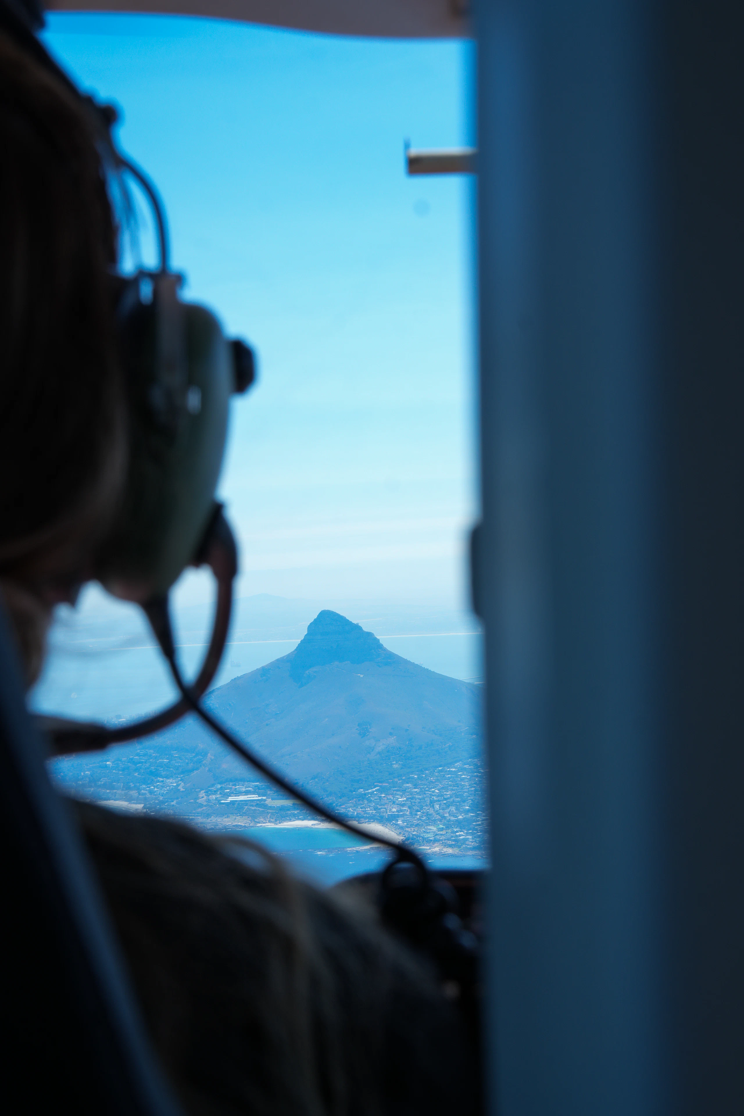 Passenger looking out of a helicopter window