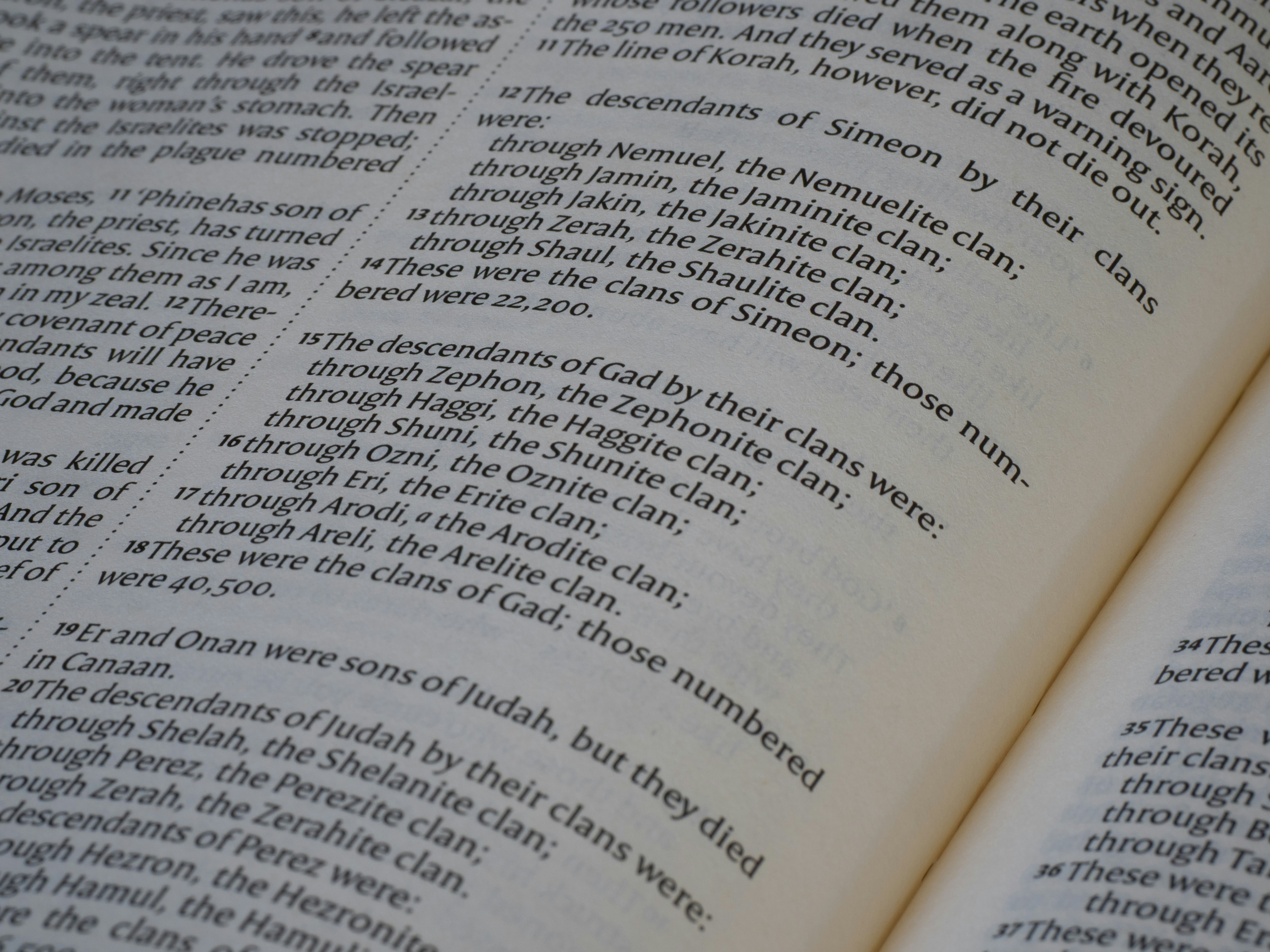 A close-up view of printed text on the pages of a book.