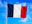 The flag of France waving on a metal pole against a blue sky