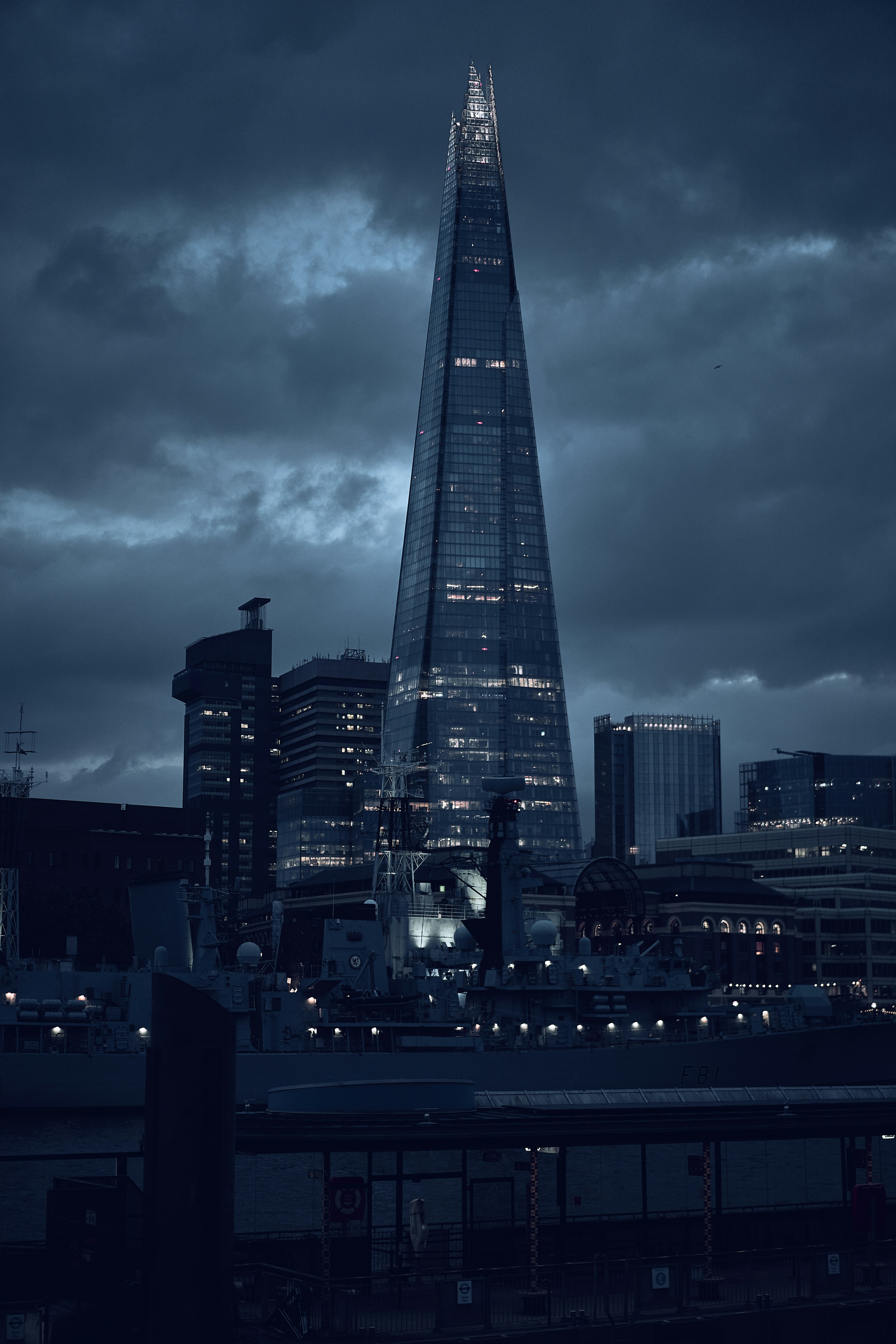 The Shard beneath dramatic clouds in London, England.