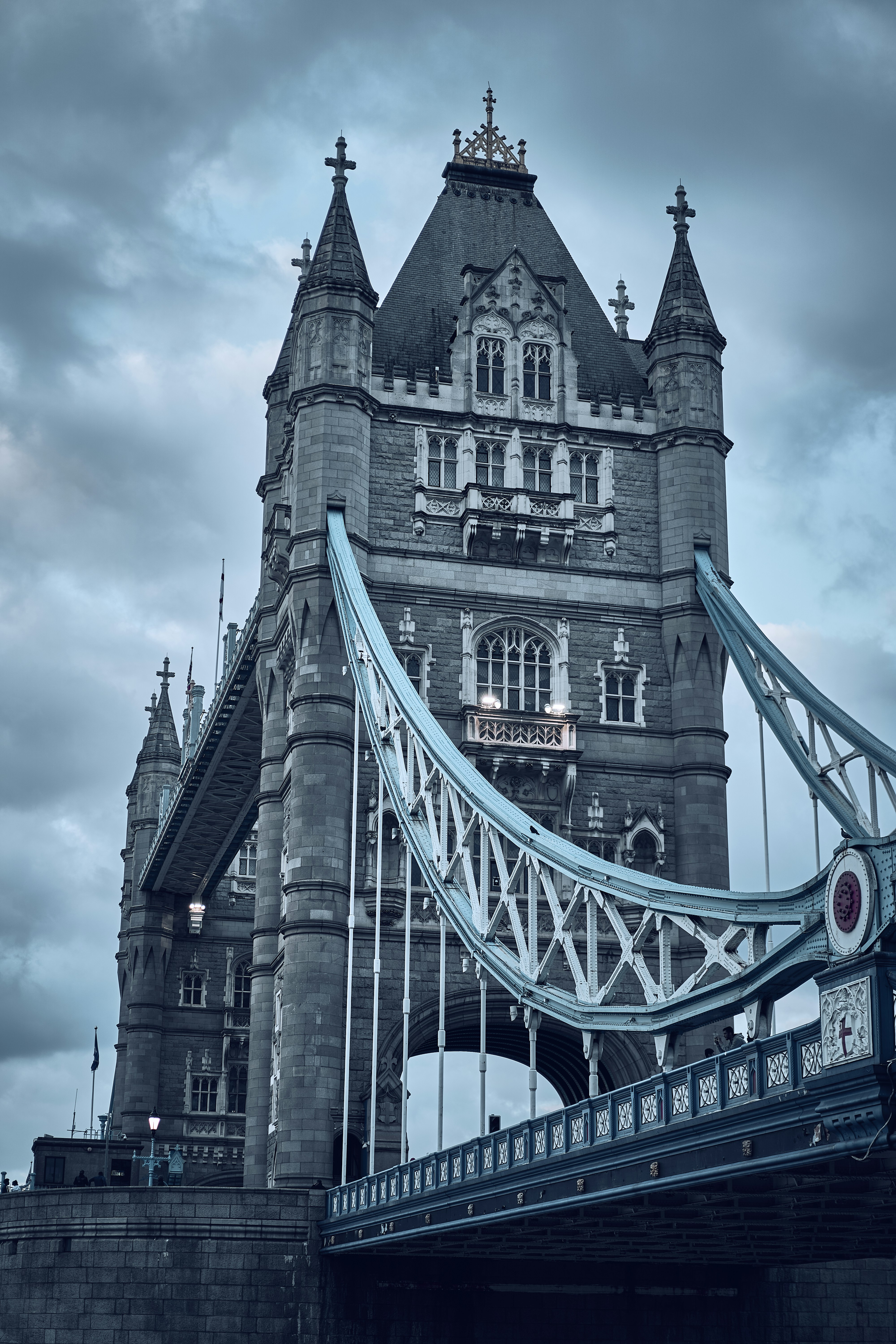 Tower Bridge beneath dramatic clouds in London, England.