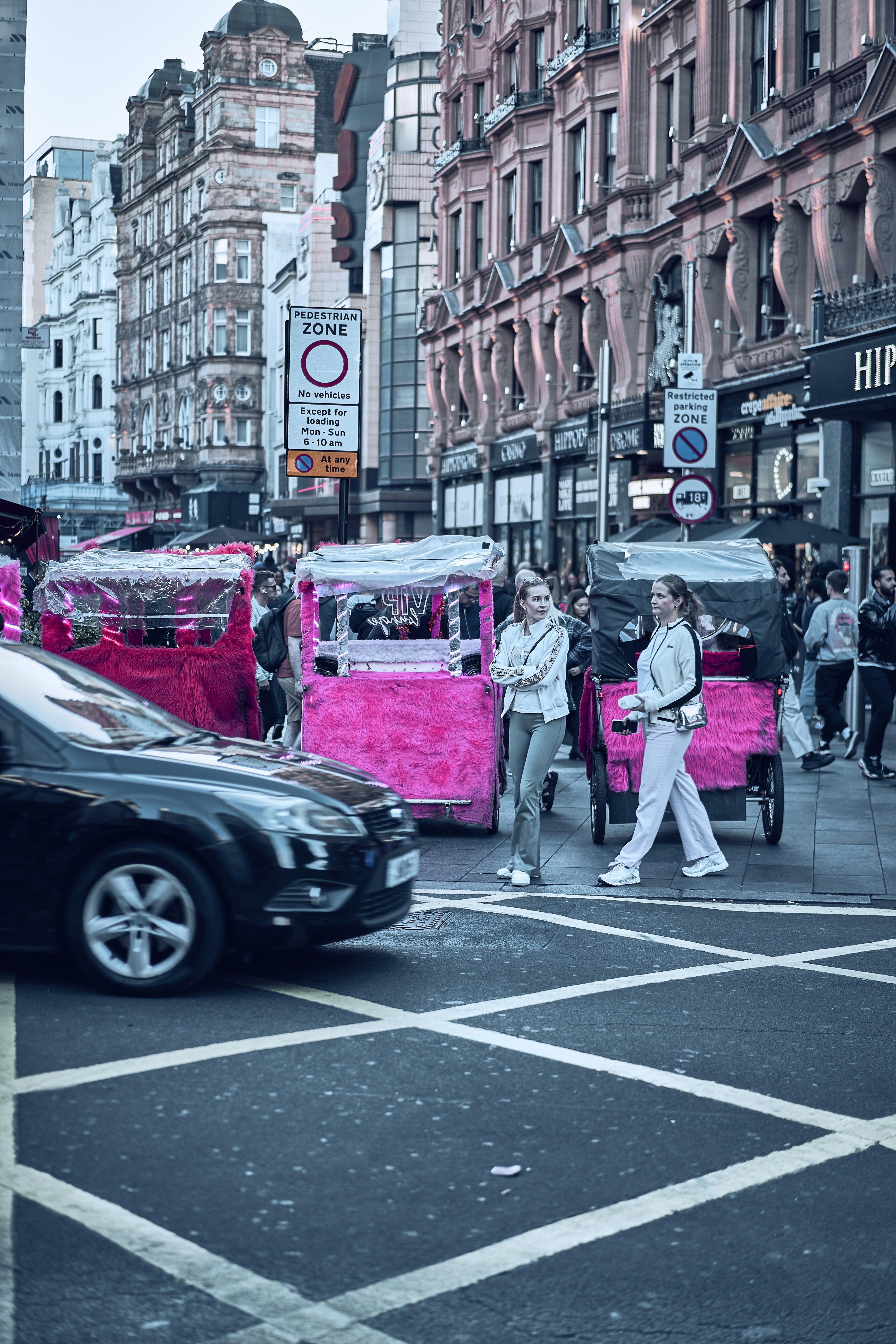 Street life around Leicester Square in London, England.
