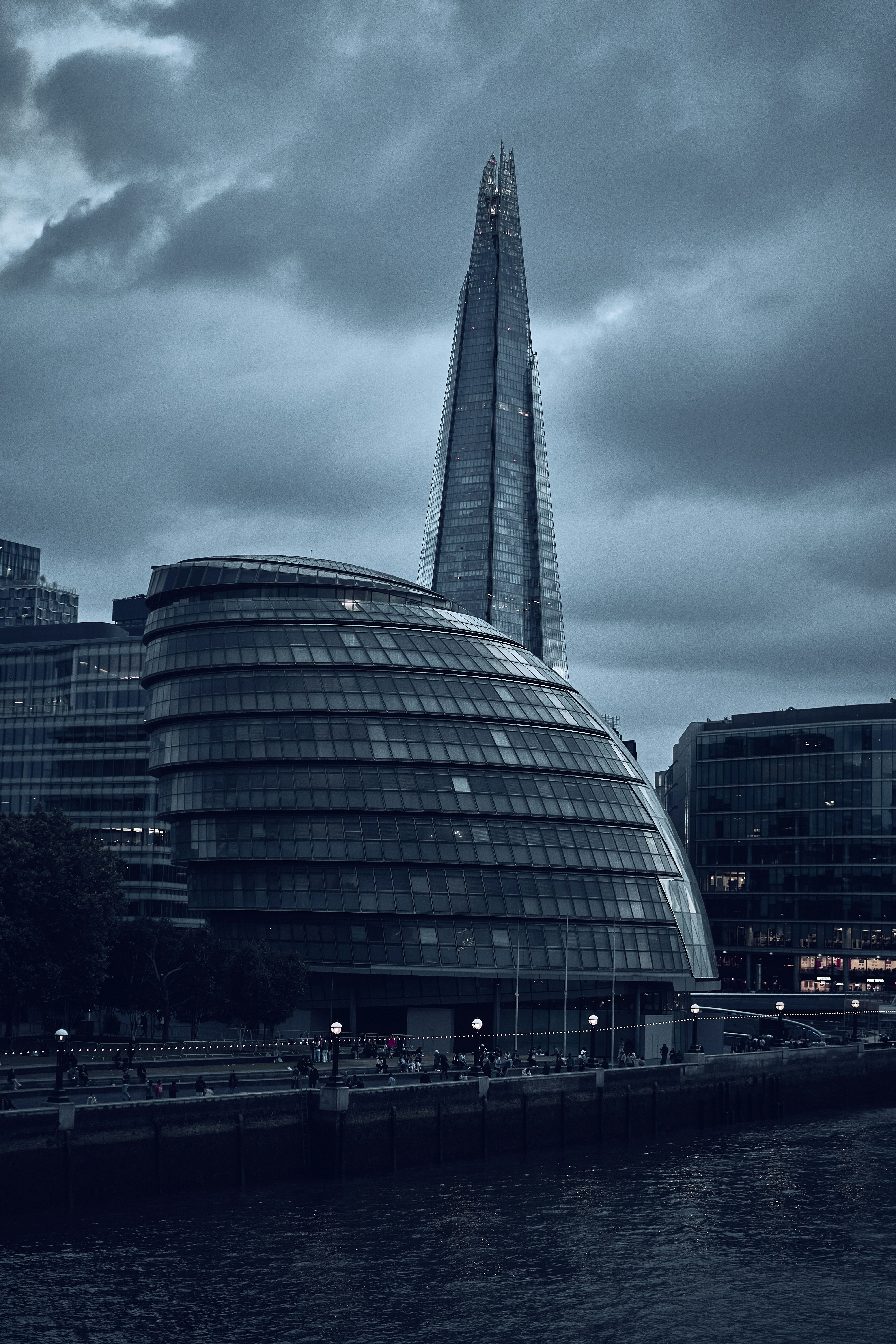 The Shard beneath dramatic clouds in London, England.