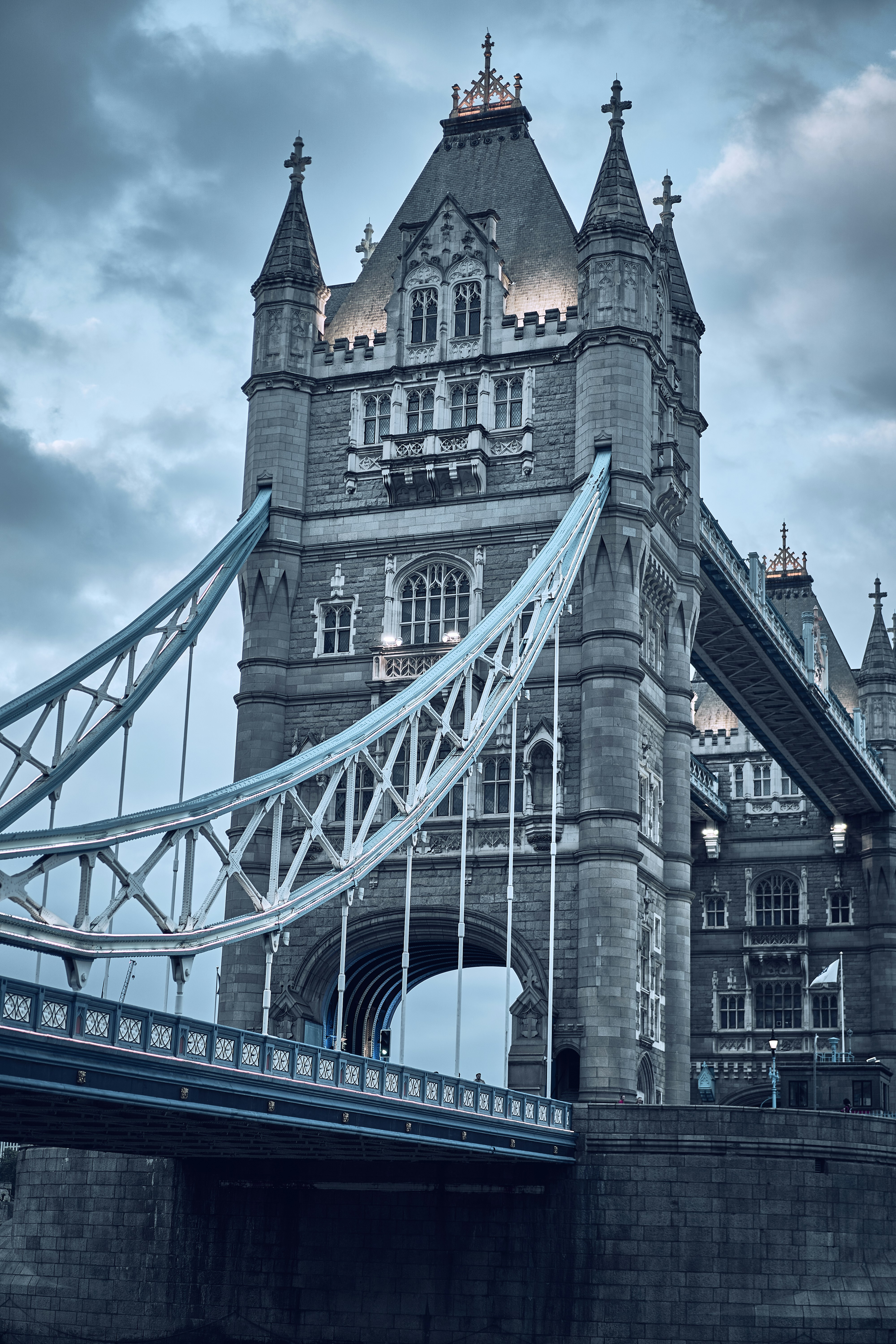 Tower Bridge beneath dramatic clouds in London, England.