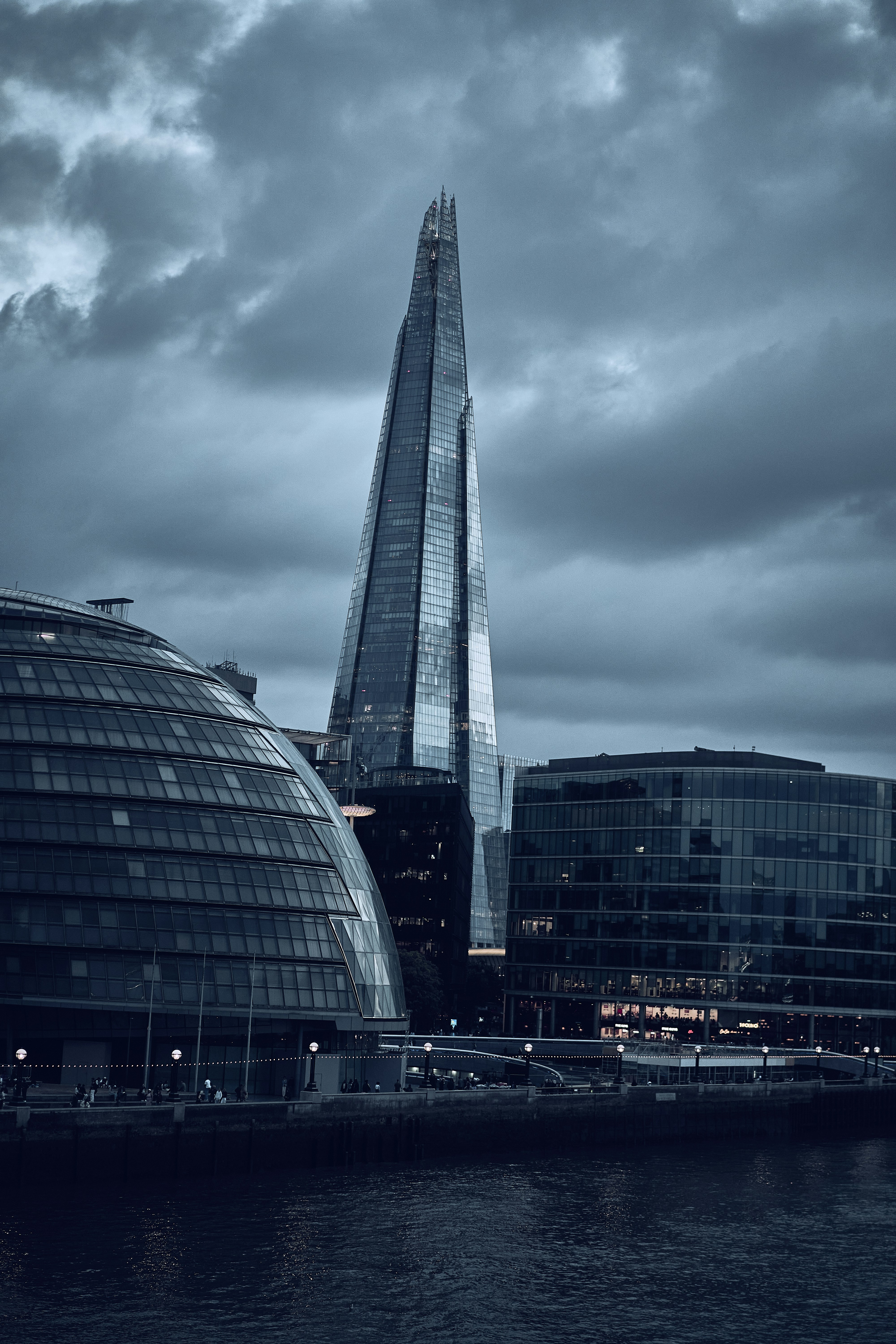 The Shard beneath dramatic clouds in London, England.