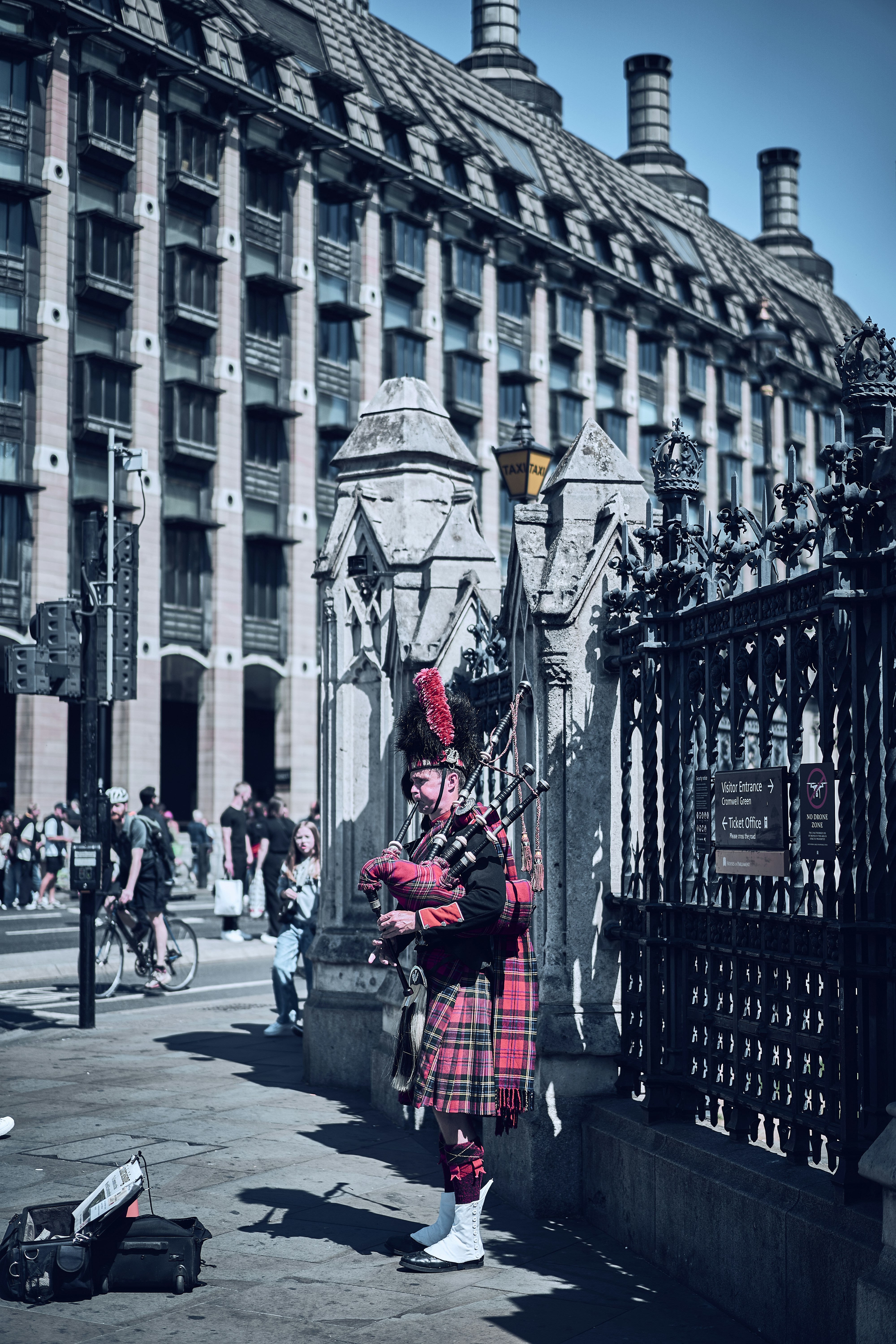 A bagpiper performing in central London, England.