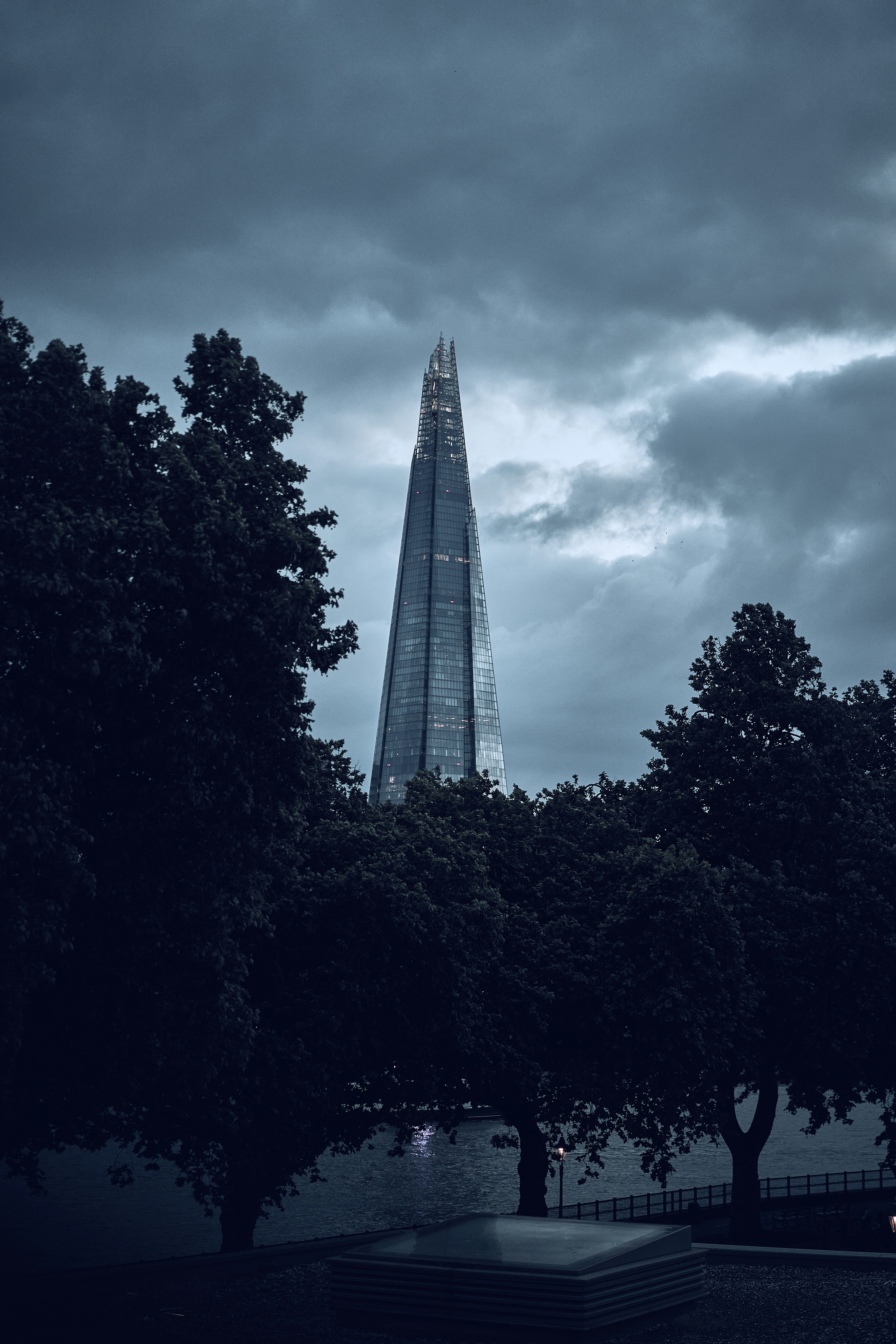 The Shard beneath dramatic clouds in London, England.