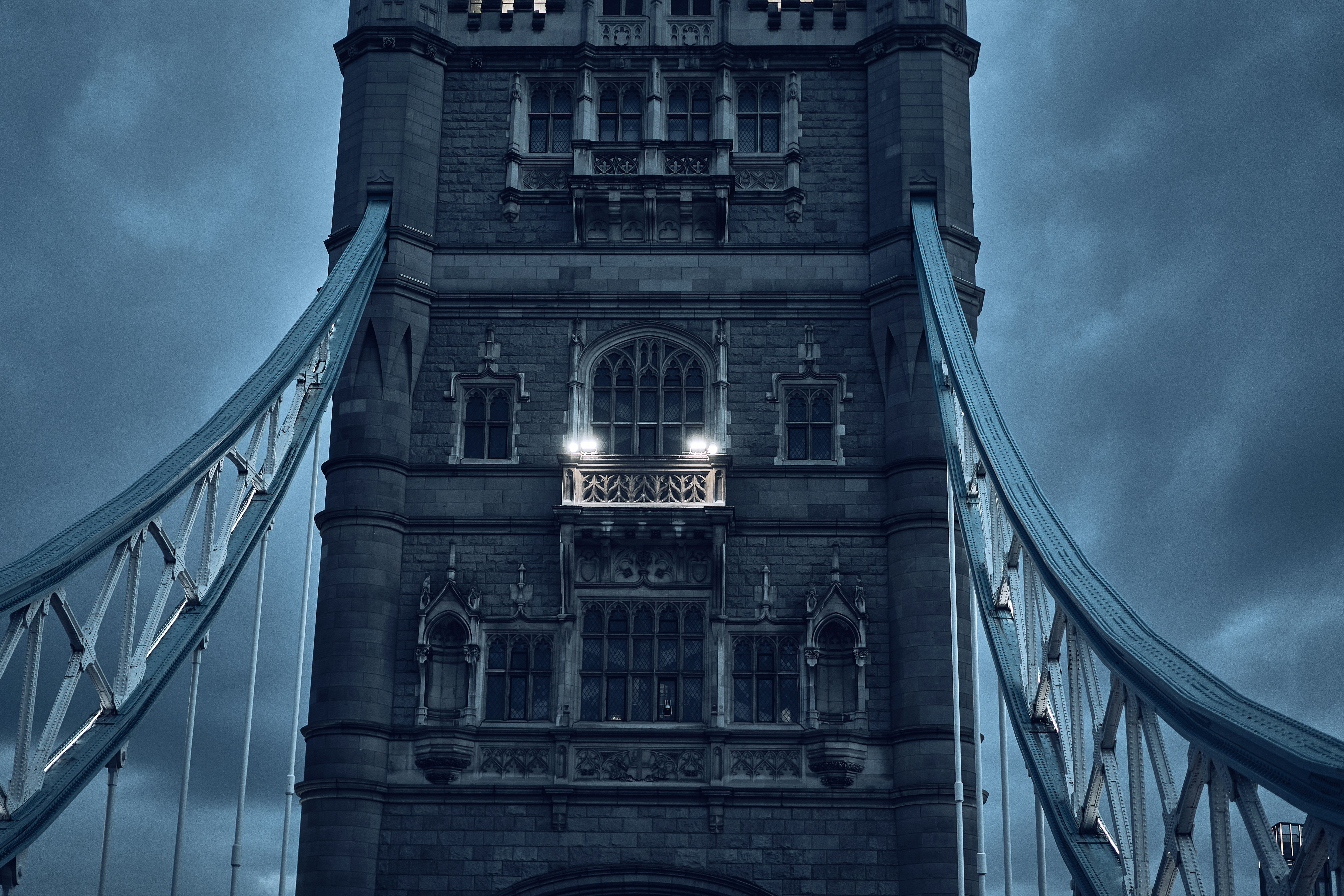Tower Bridge beneath dramatic clouds in London, England.