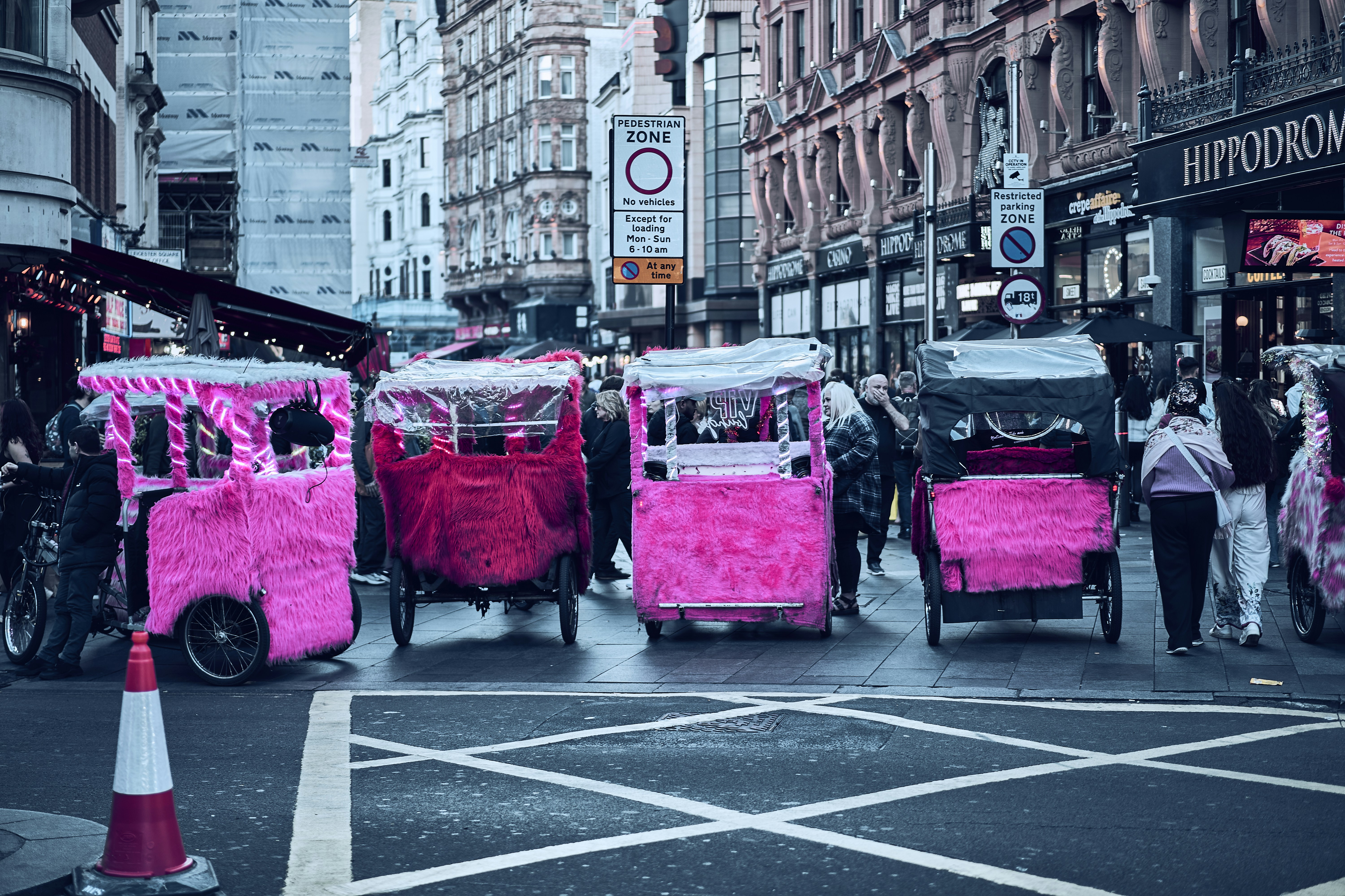 Street life around Leicester Square in London, England.