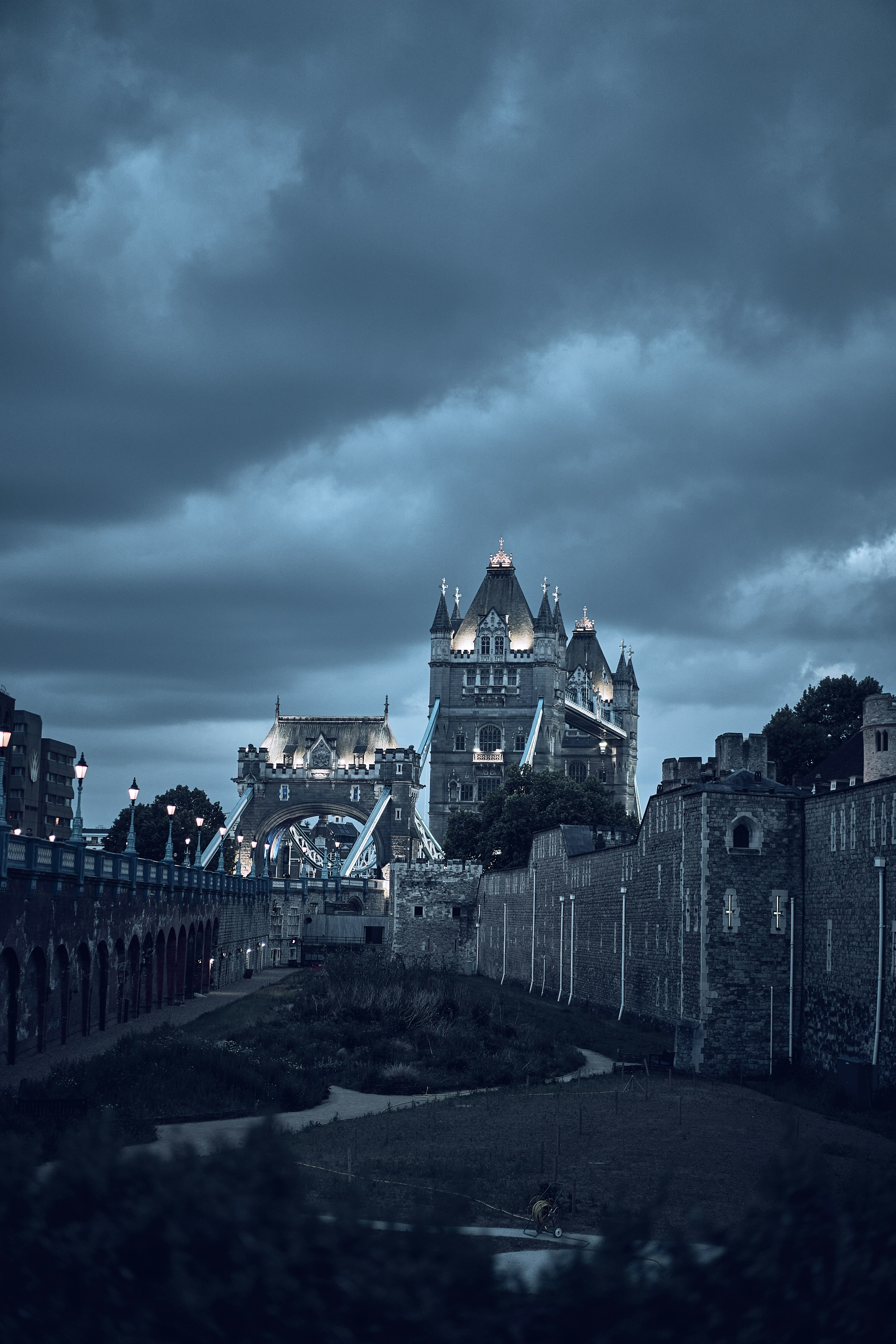 Tower Bridge beneath dramatic clouds in London, England.