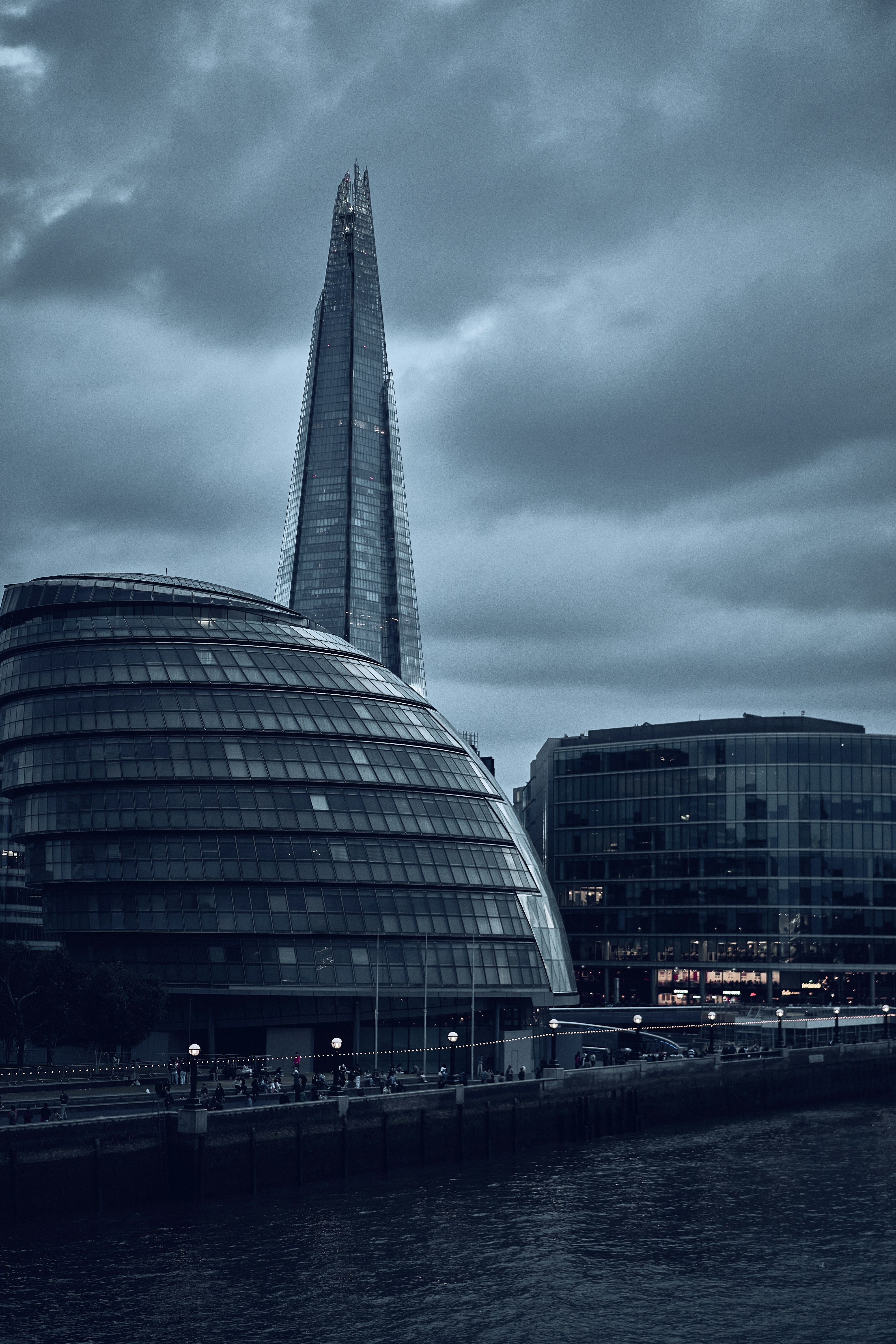 The Shard beneath dramatic clouds in London, England.