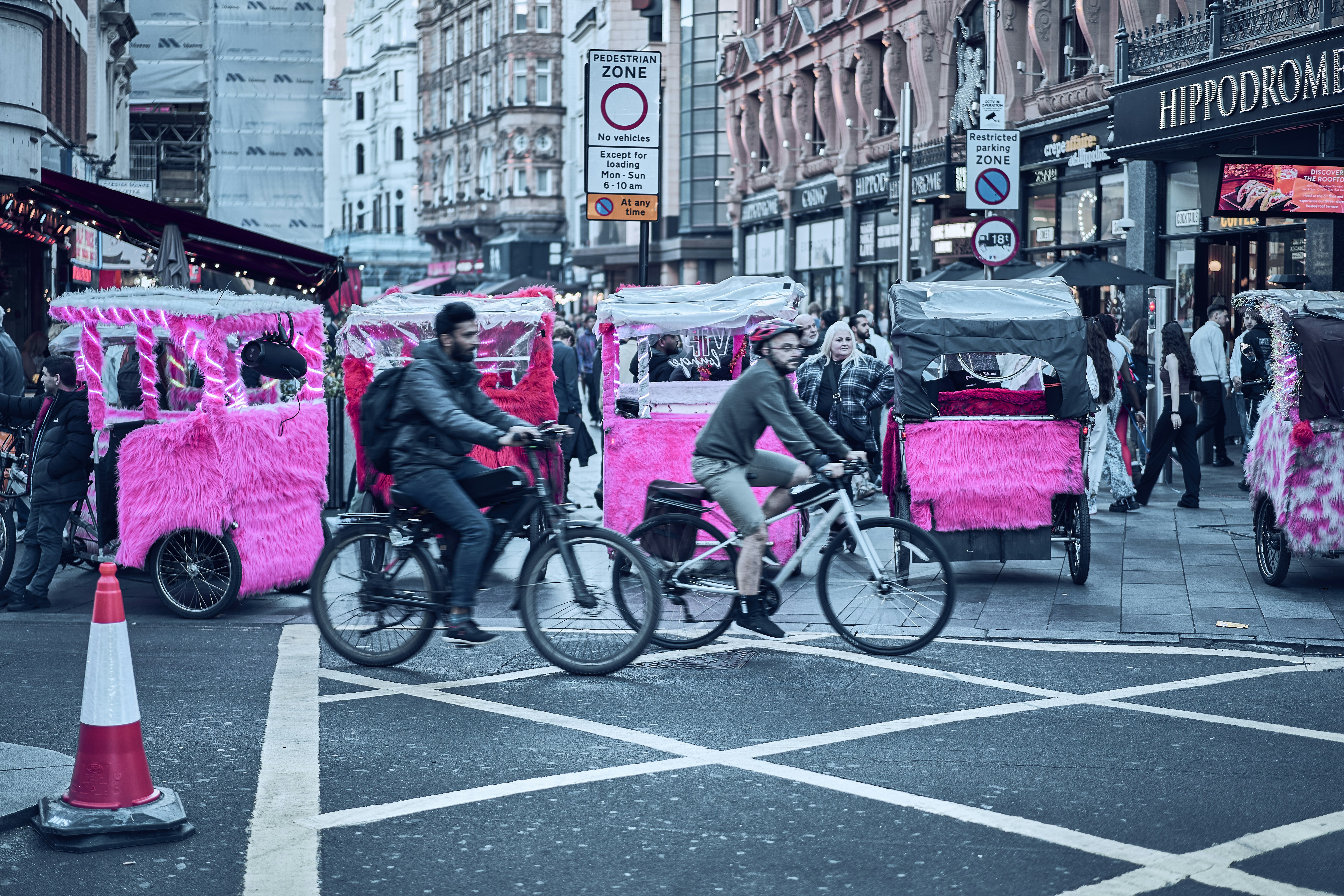 Street life around Leicester Square in London, England.