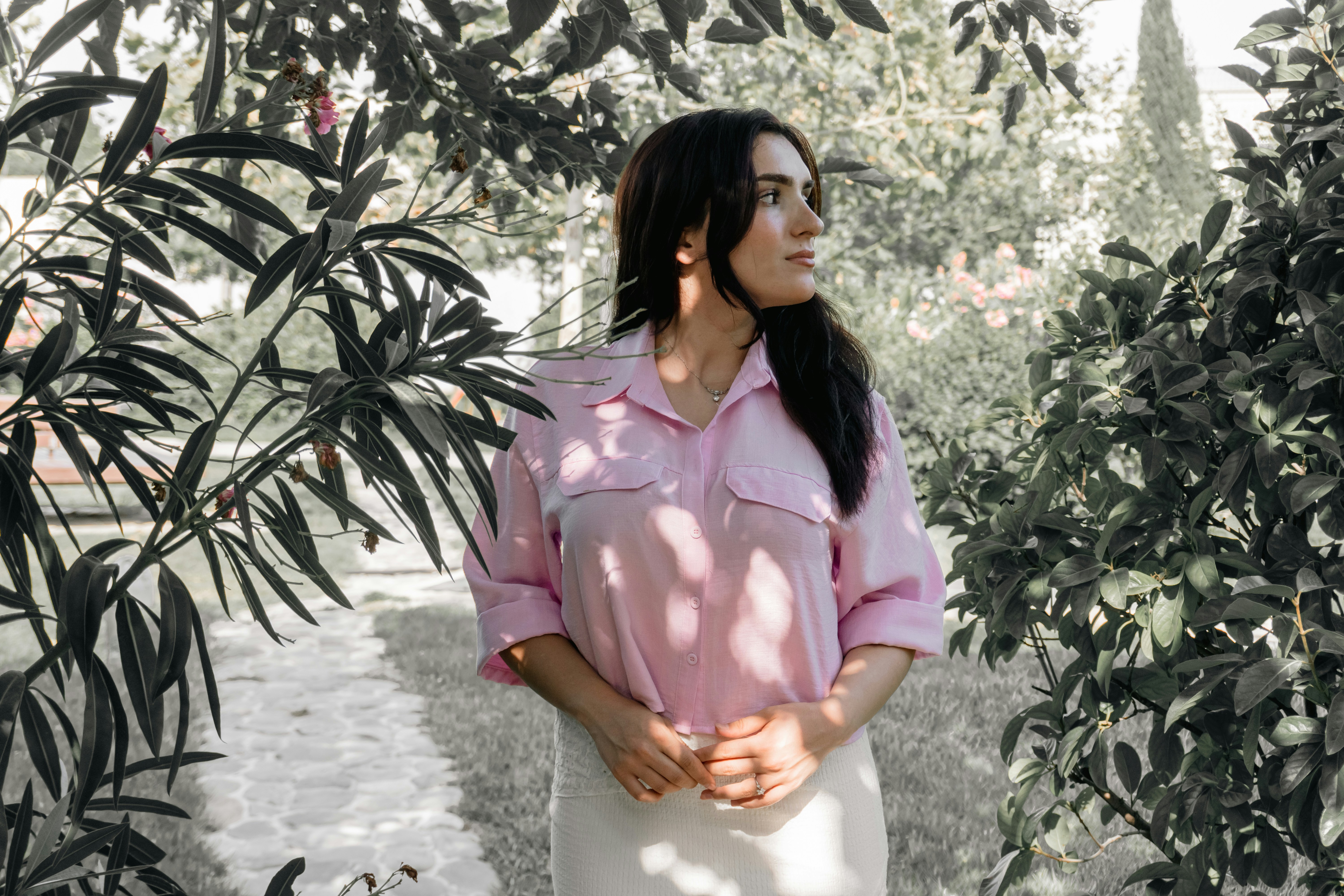 Indian woman meditating in a serene garden at sunrise