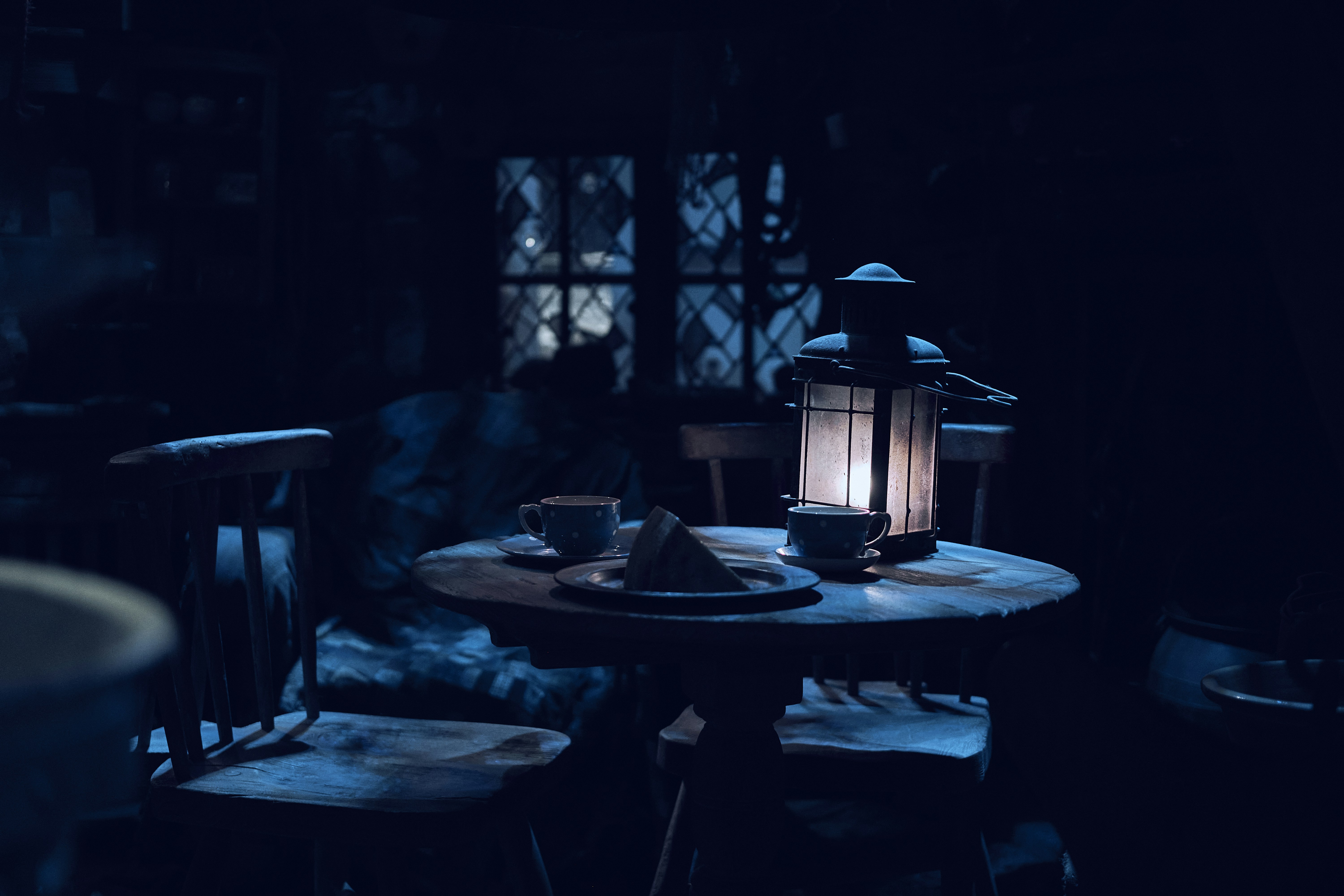 A lantern-lit table set at the Warner Bros. Studio Tour London.