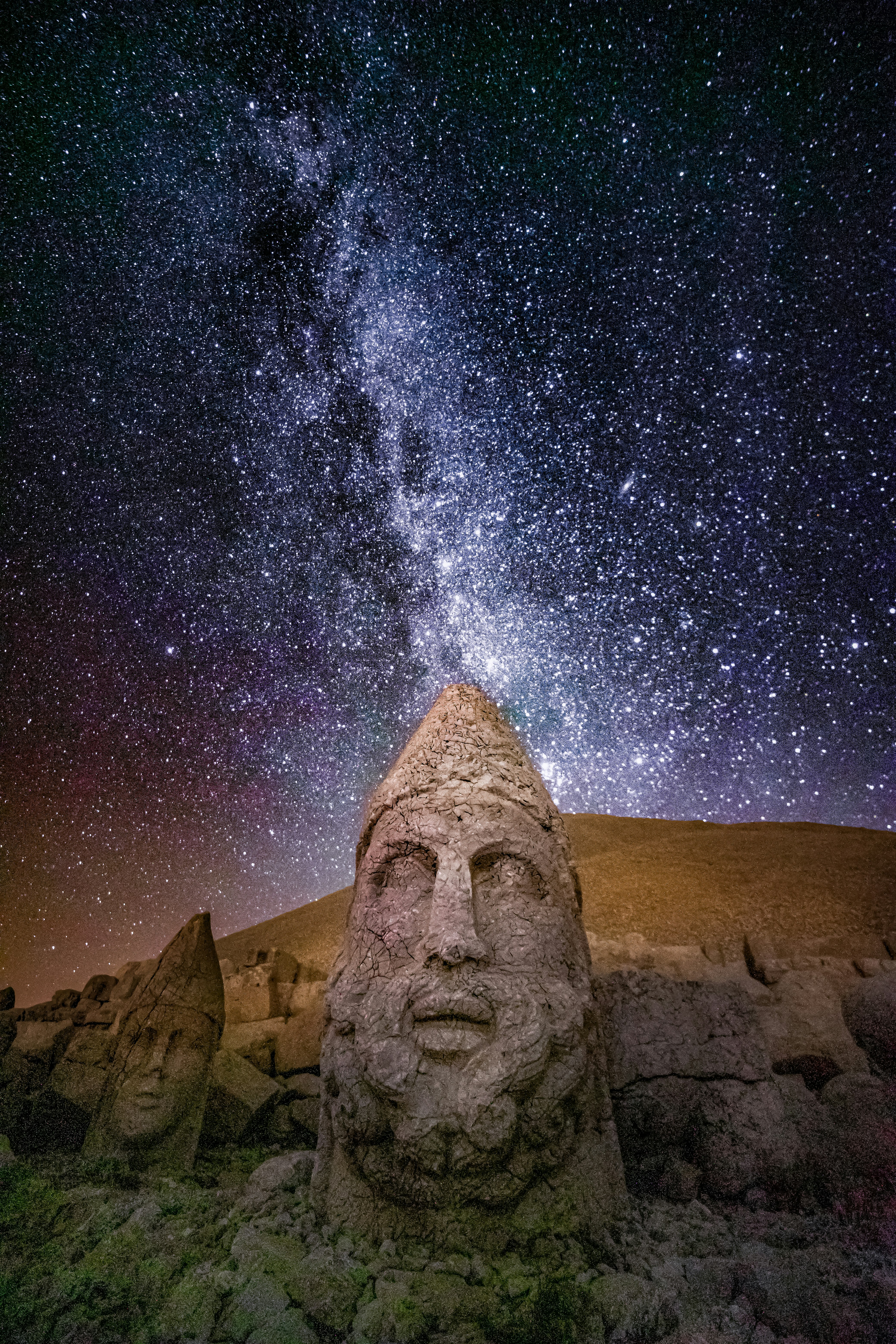 Stone heads of Mount Nemrut under a starry night sky with the Milky Way