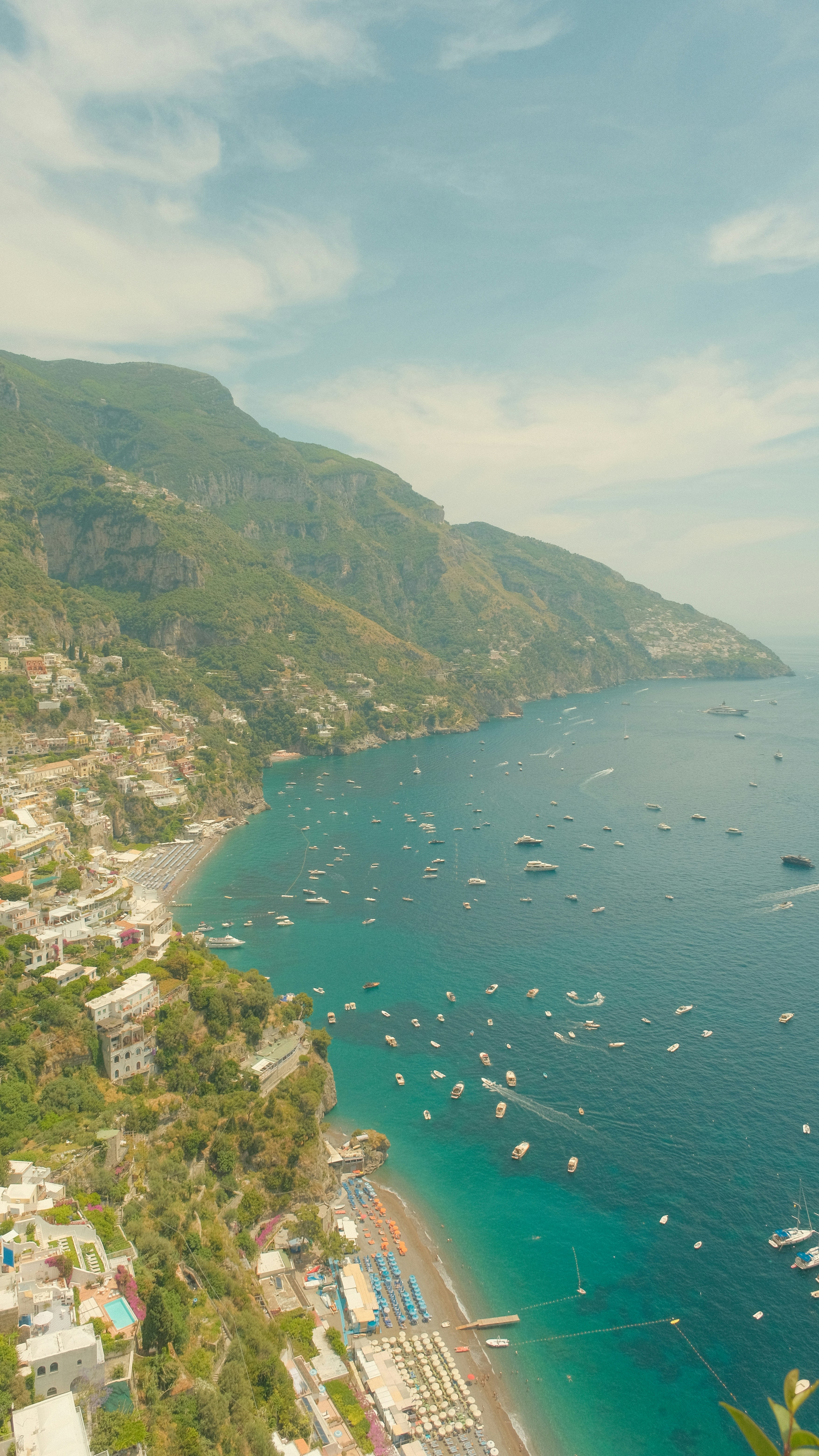 Aerial view of Positano with colorful buildings on a cliffside above the Mediterranean Sea